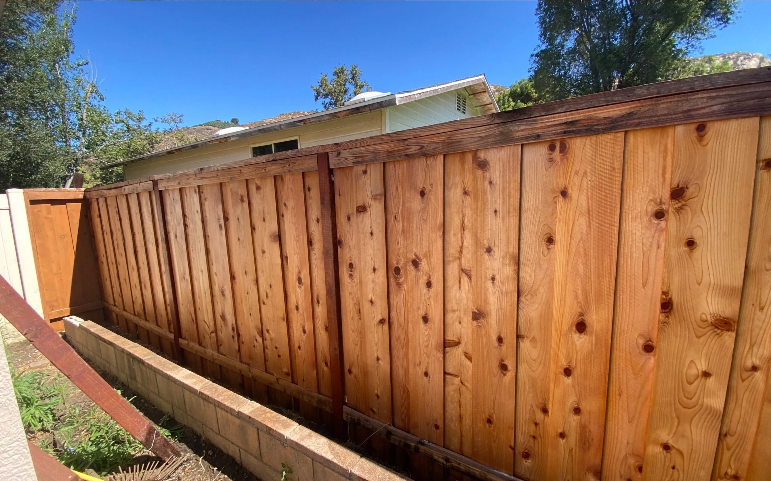 Wood fence looks like new after a soft wash with special wood safe chemicals..