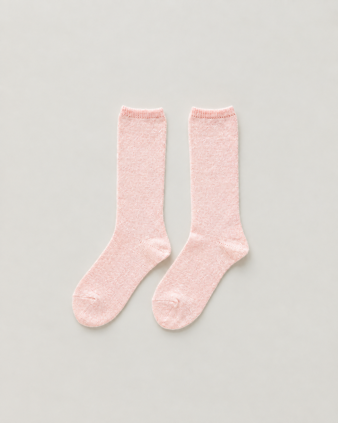 Pastel Pink Socks on Neutral Background.png