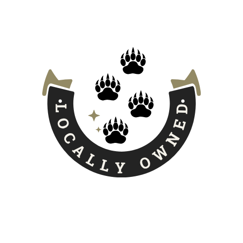 A black horseshoe-shaped magnet with the words 'Locally Owned' written on it, surrounded by stars and bear claw.