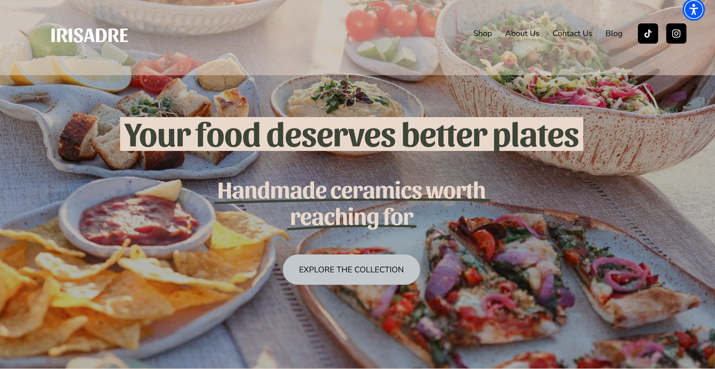 A rustic outdoor table with a bowl, a small jar, a yellow fruit, and a wooden bowl filled with small yellow potatoes, with shadows of leaves cast across the table.