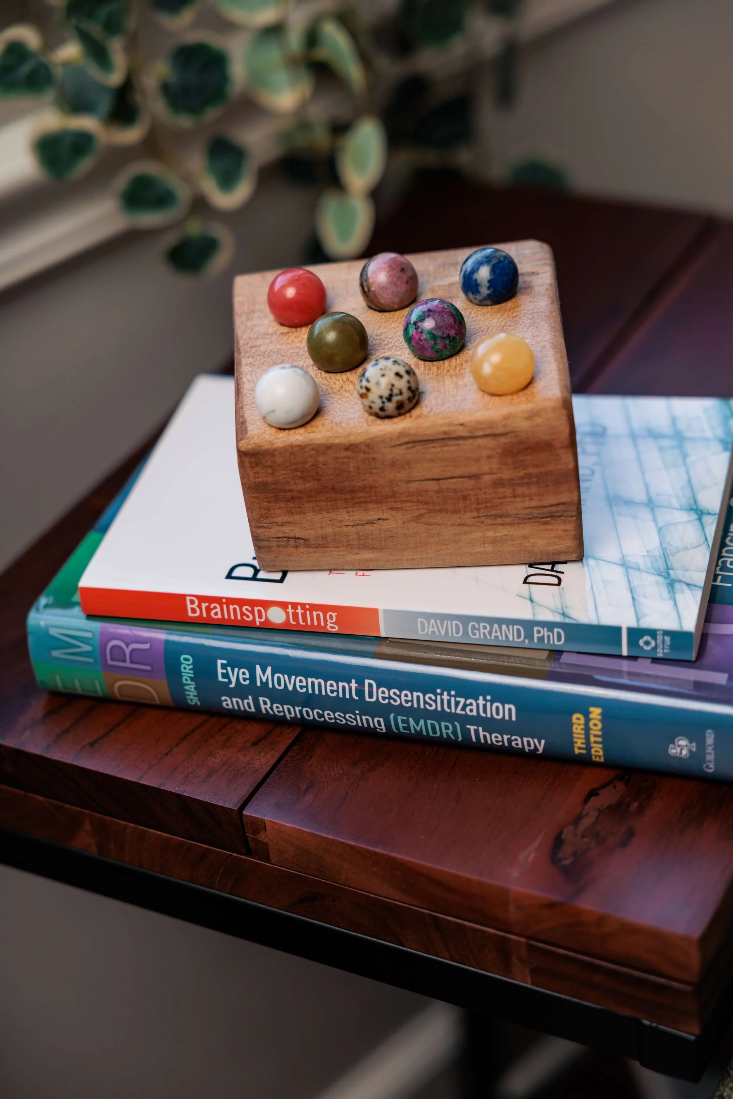 Stacked books about brainspotting and EMDR