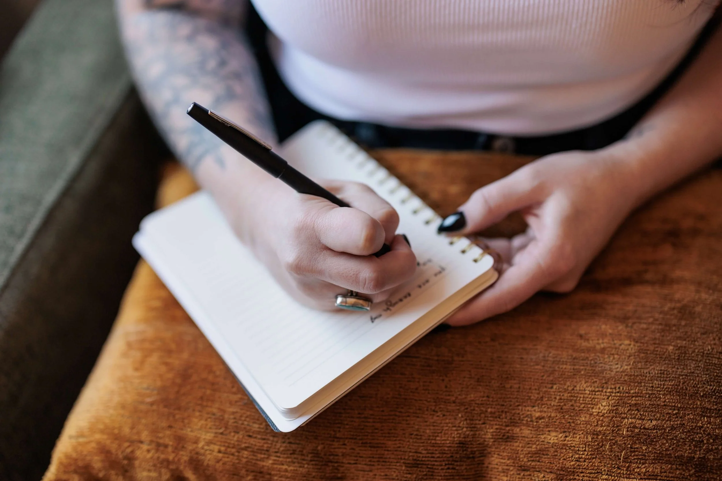 Kaylie writes in a lined notebook.