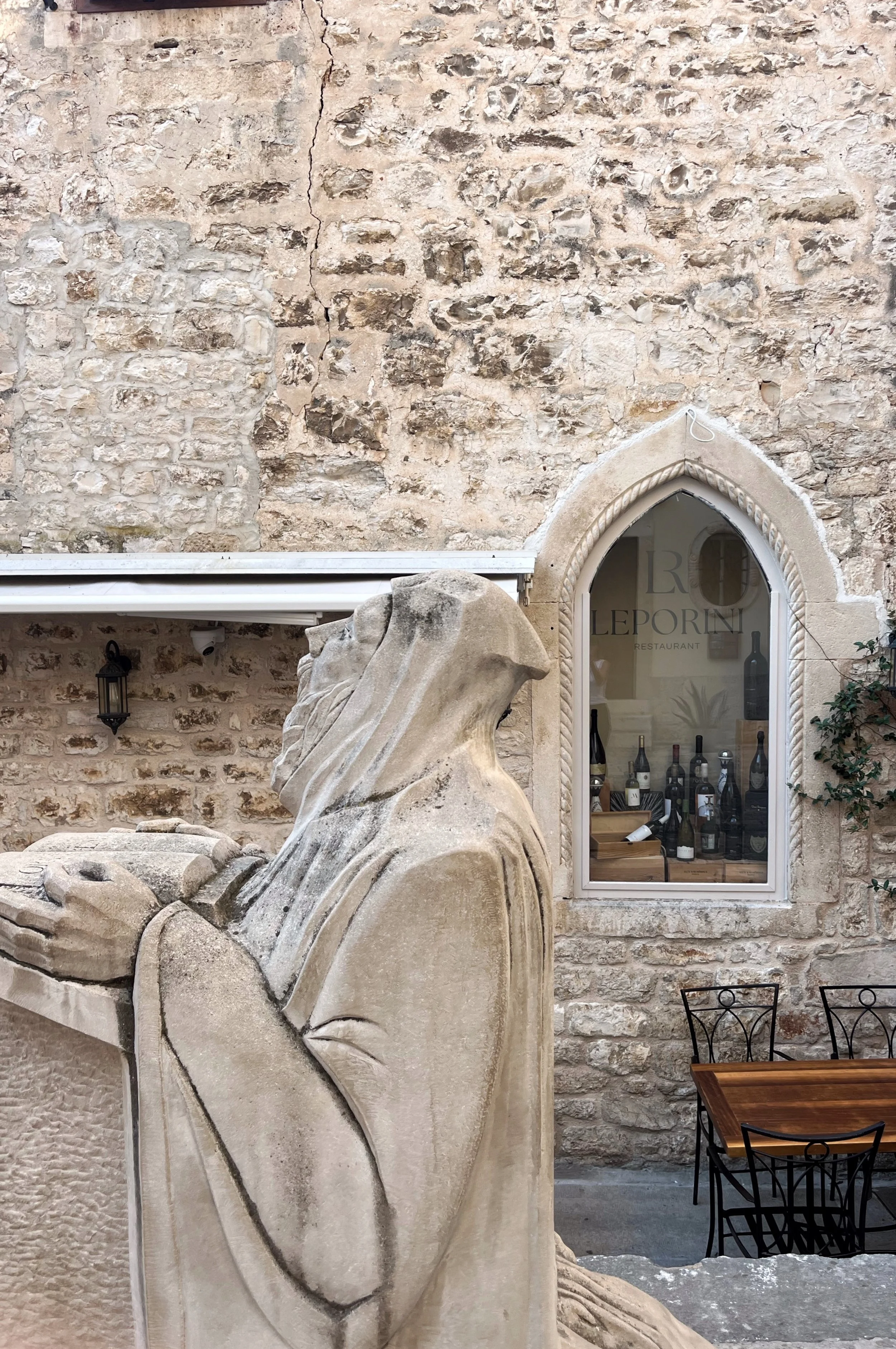 Stone sculpture in historic center of town of Hvar, Hvar island. Old and stylish, luxurious walk through one of the gems of Croatia. The most sunny island of our coast: special summer experience, food paradise, vibrant and with elegance.