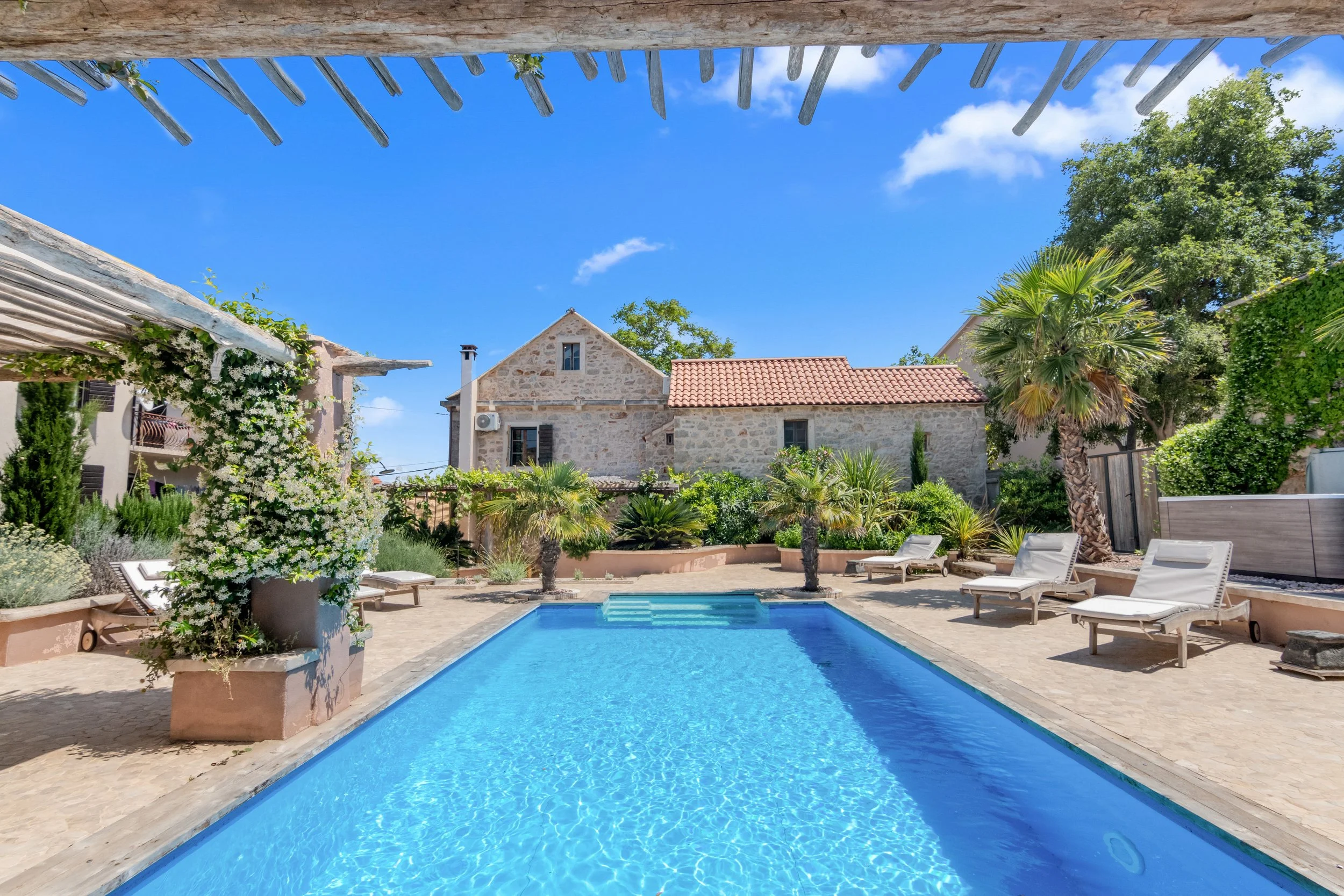 villa-oaza-vrbanj-hvar-pool-and-stone-house.jpg