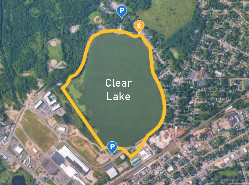 Satellite map of Clear Lake with a yellow trail around it, two parking spots marked with blue P icons, and a hiker icon near the top of the trail.