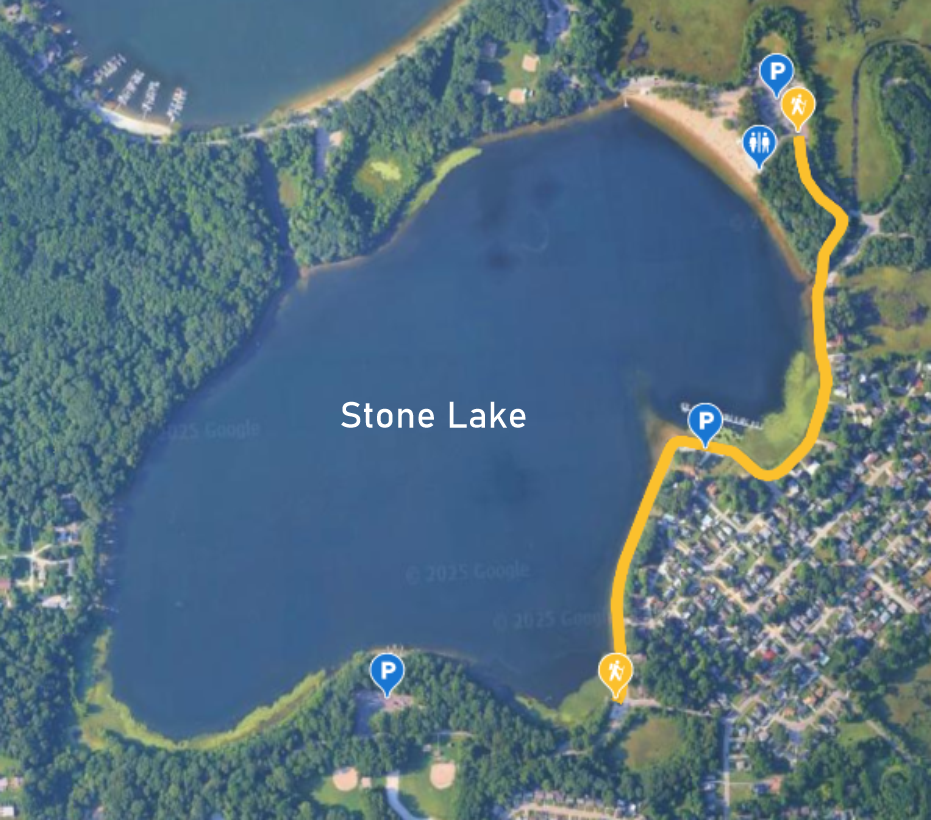 Aerial map of Stone Lake with marked parking lots, walking trails, and recreational facilities around the lake.
