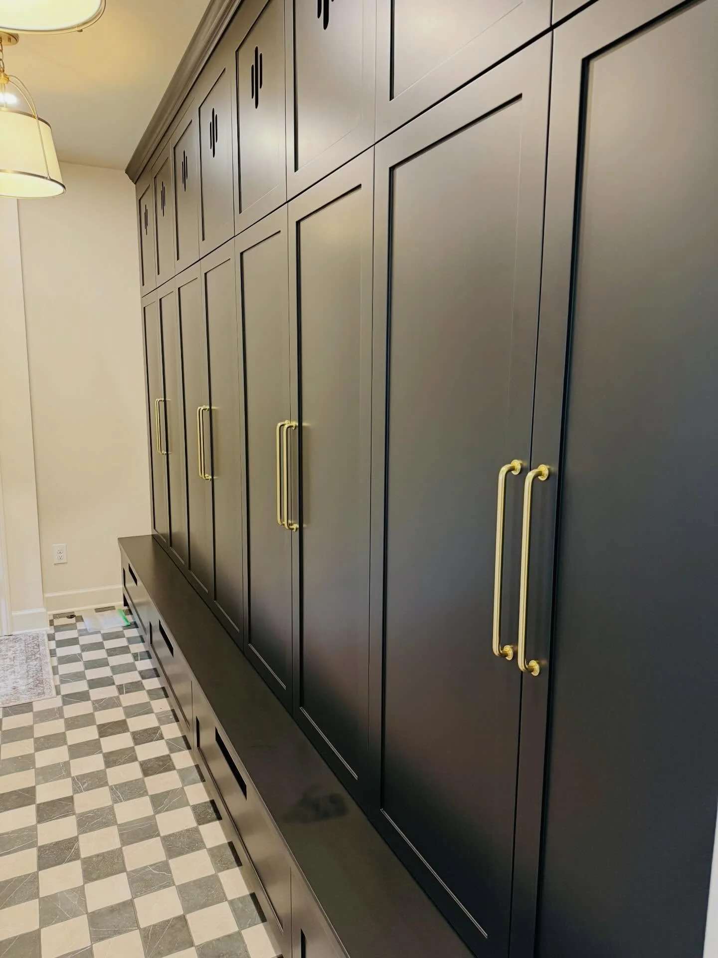 A refined welcome, reimagined.

This custom mudroom was designed to elevate the everyday - featuring oversized, fully tailored cabinetry and thoughtfully integrated lower pull-outs, all finished with soft-close precision.

A seamless blend of functio