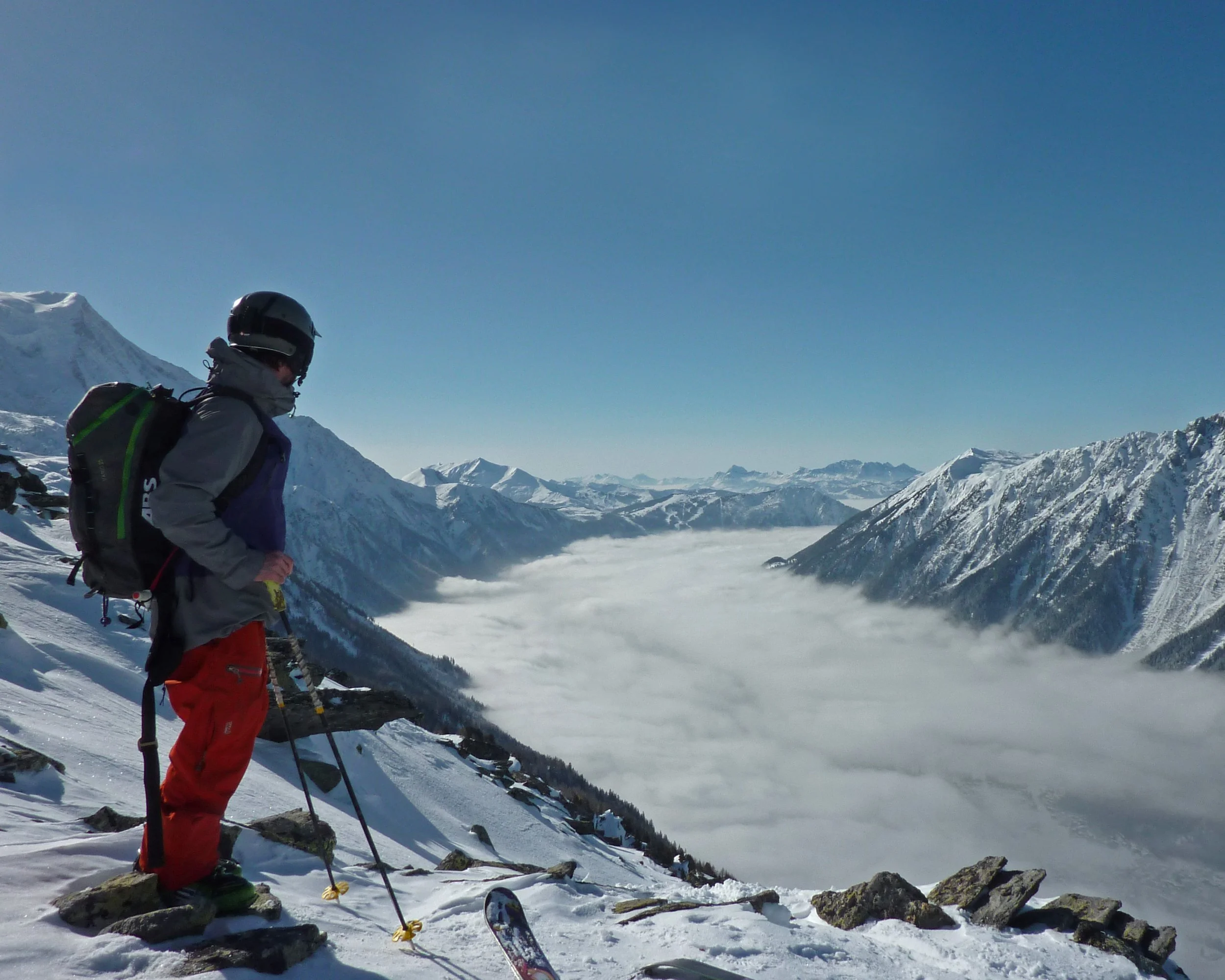 off-piste skier looking at mountain view in the Espace Killy
