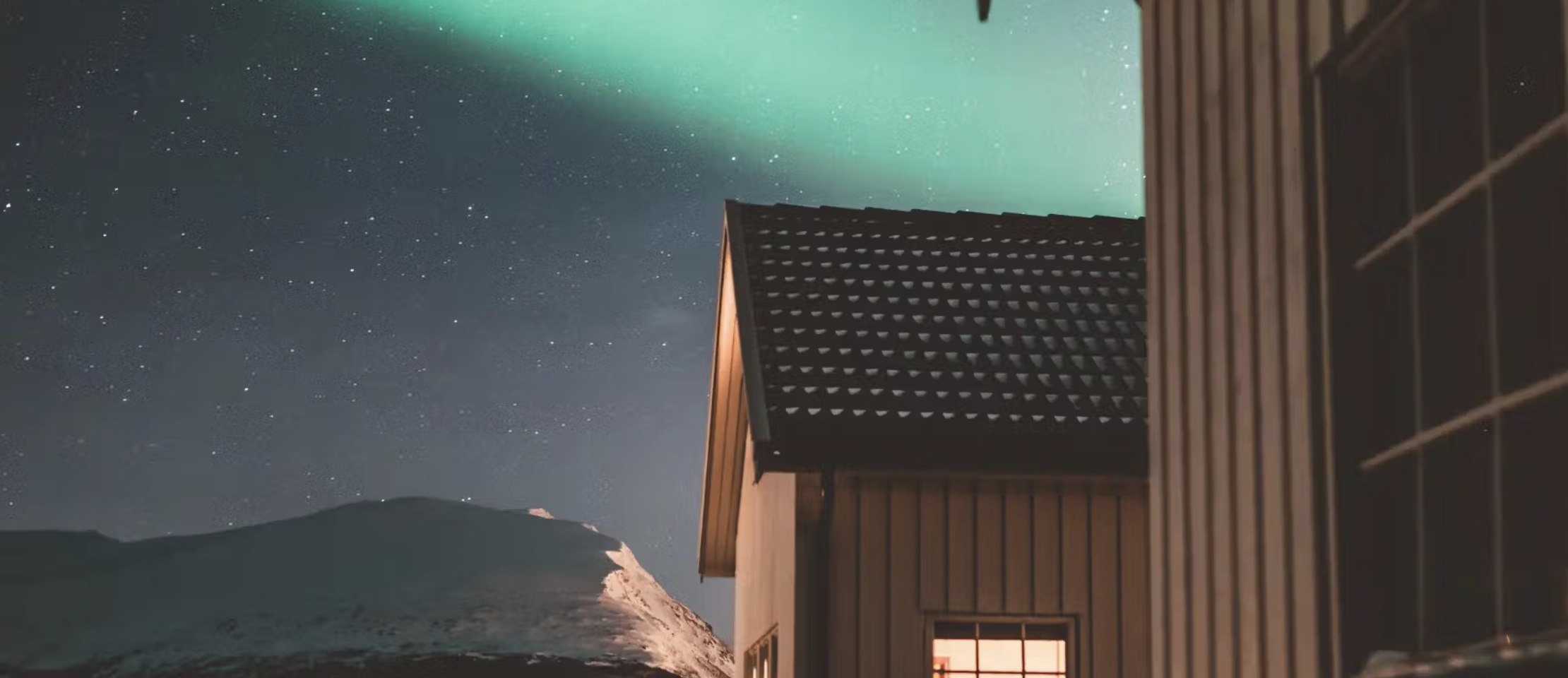Sea cabin in Norway beneath the Northern Lights.