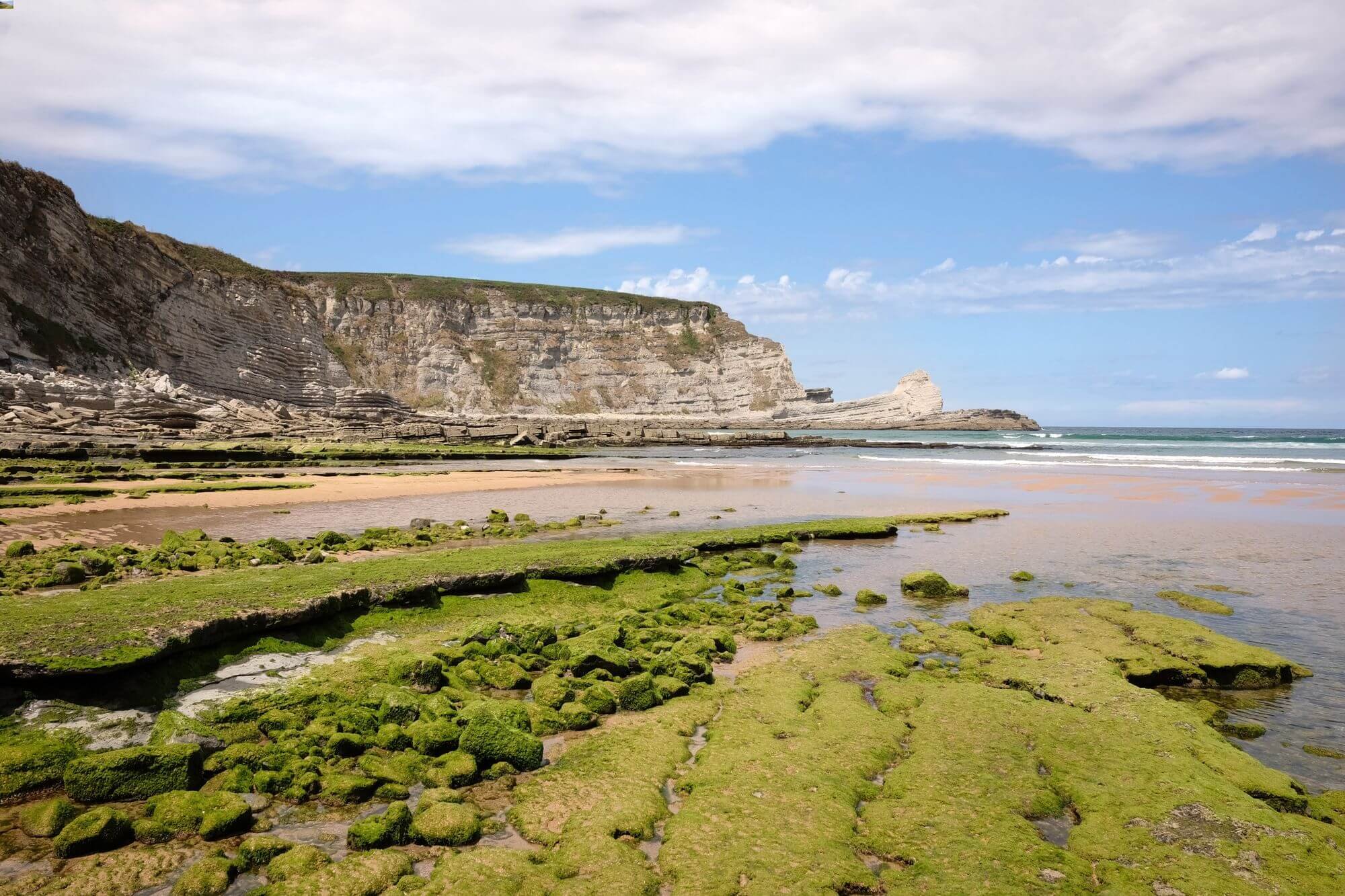 View of a coast with cliffs and a beach of northen Spain.