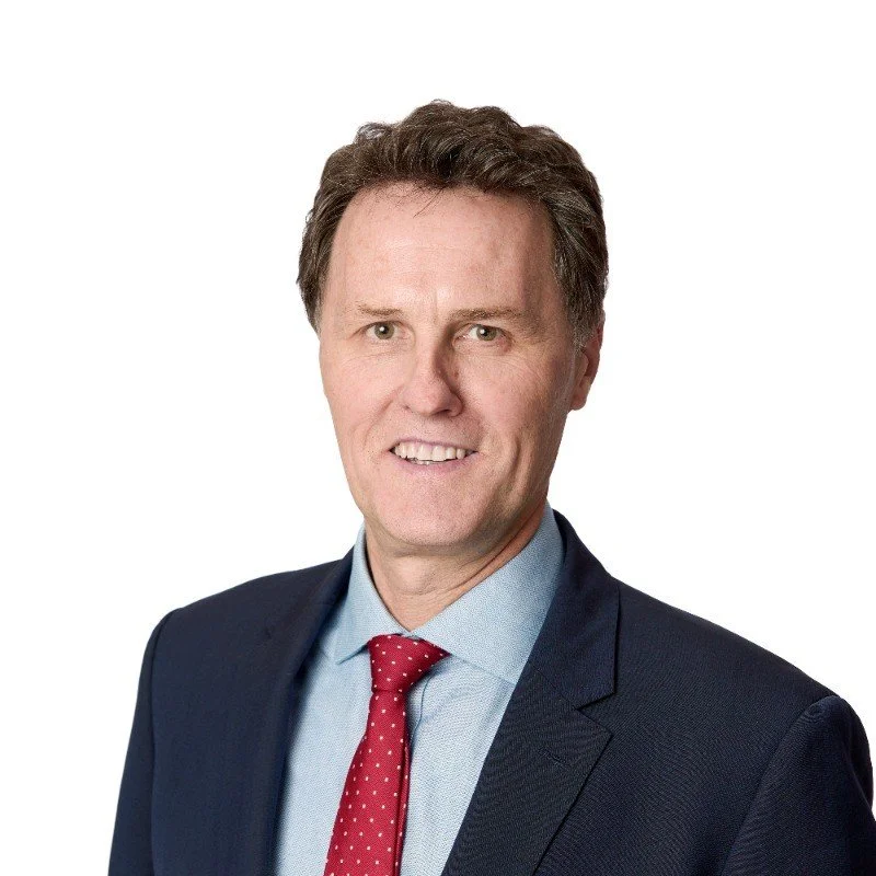 Silhouette of a person with long hair against a white background.