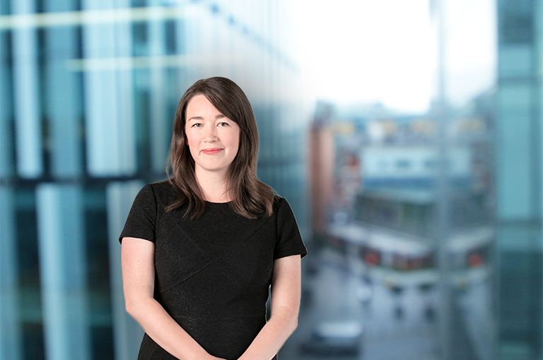 Silhouette of a person's head and shoulders, facing forward.