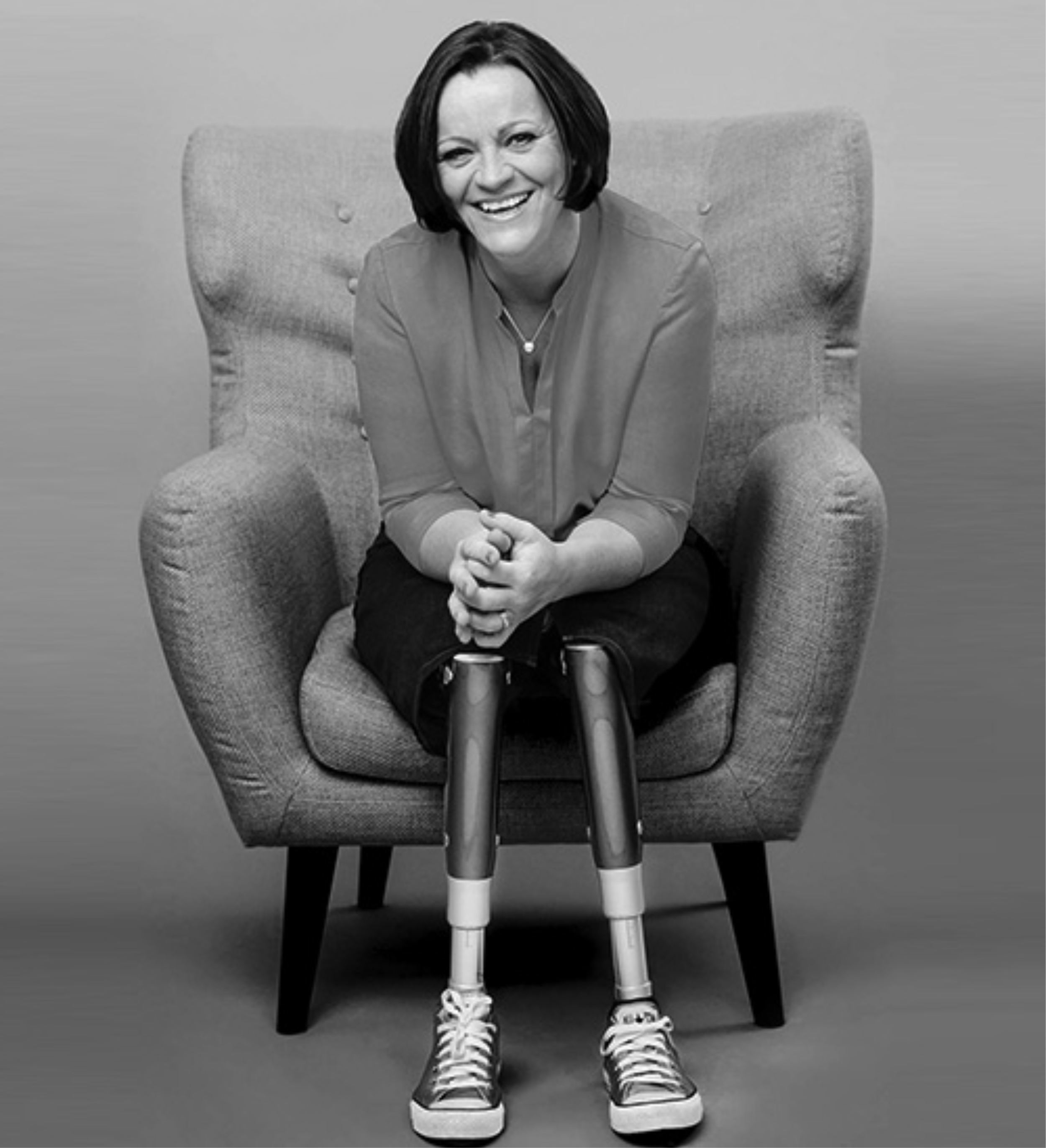 Silhouette of a person with long hair against a white background.