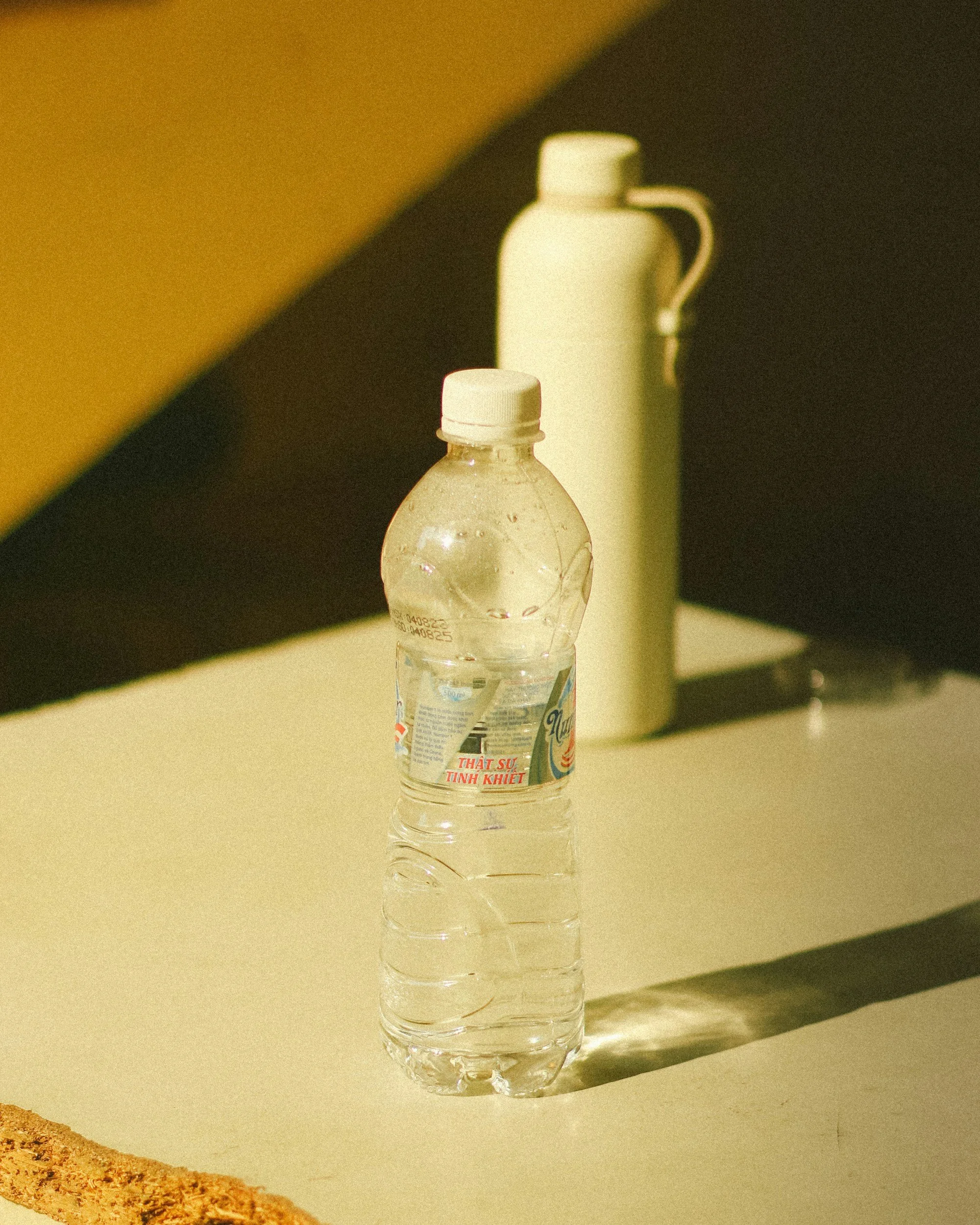 Kids water bottle on a classroom table, reusable BPA-free bottle for school and learning environment