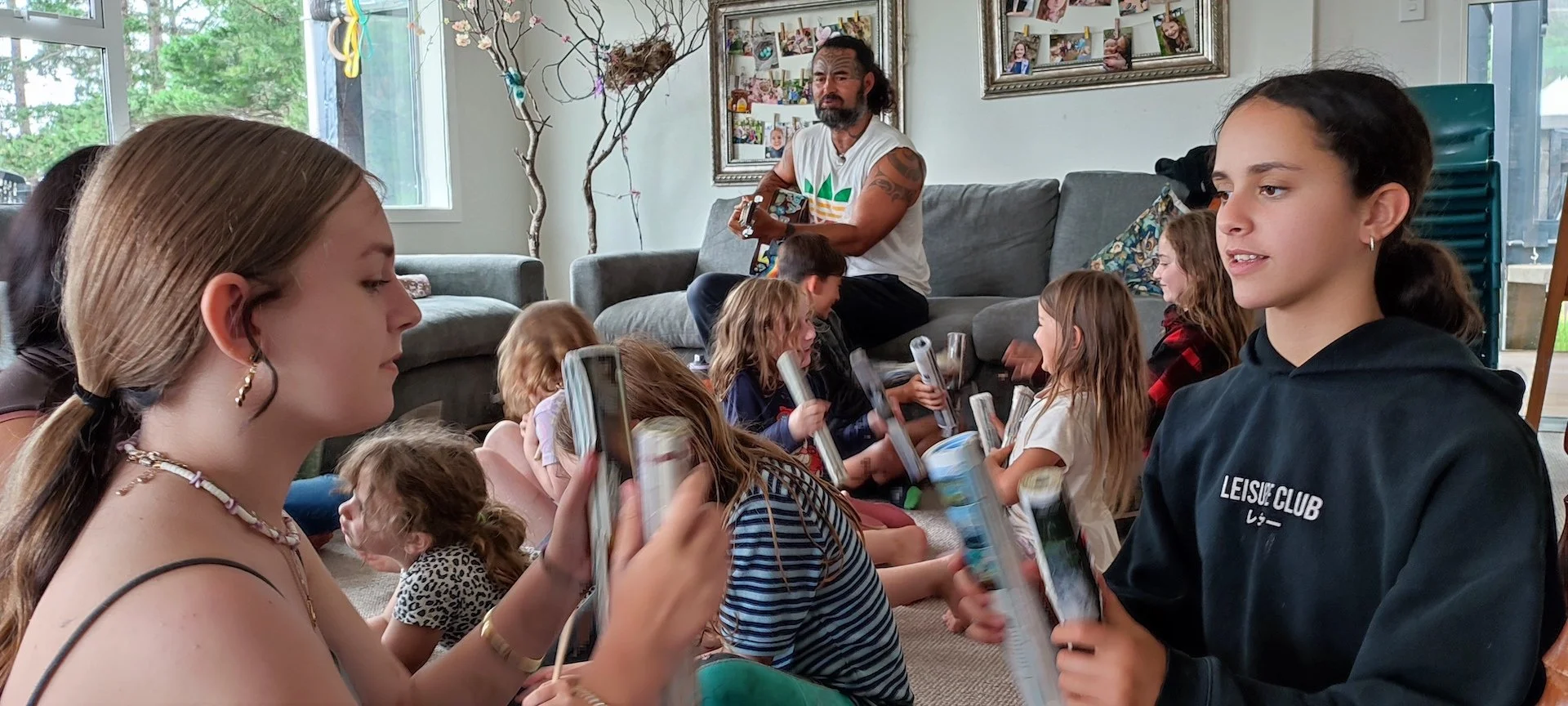 Earth School children measuring the circumference of a tree with their arm spans.
Nature learning activity.