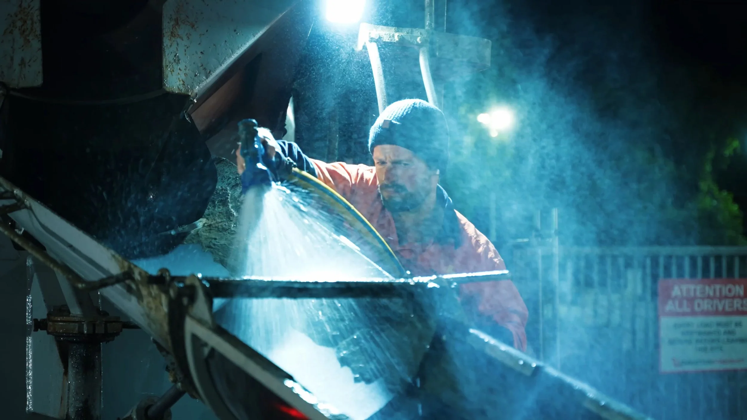 Construction worker spraying equipment