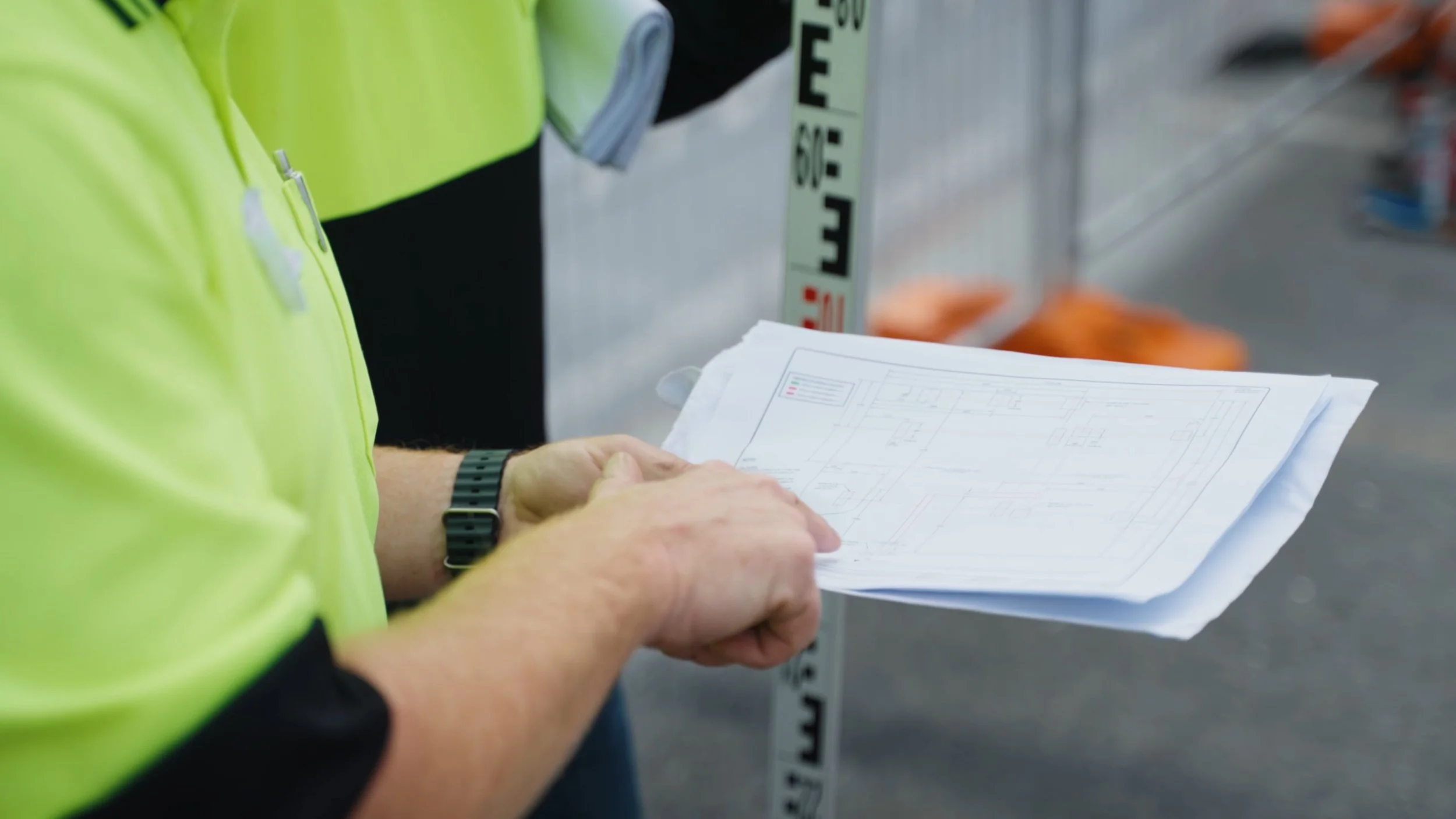 Man pointing at blueprints