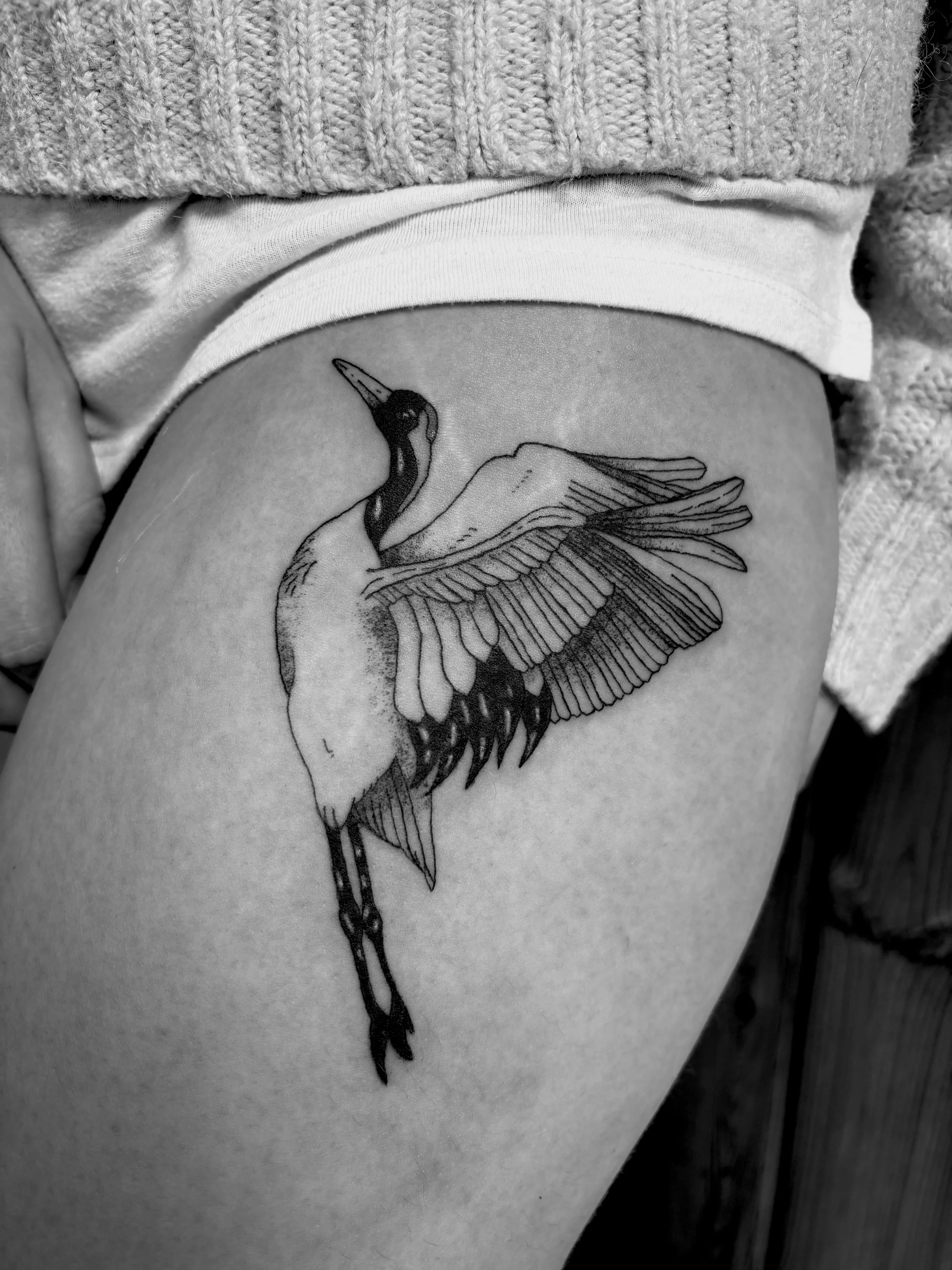 fineline bird thigh tattoo