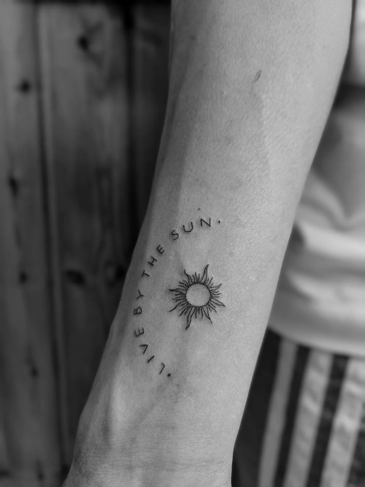 fineline sun tattoo