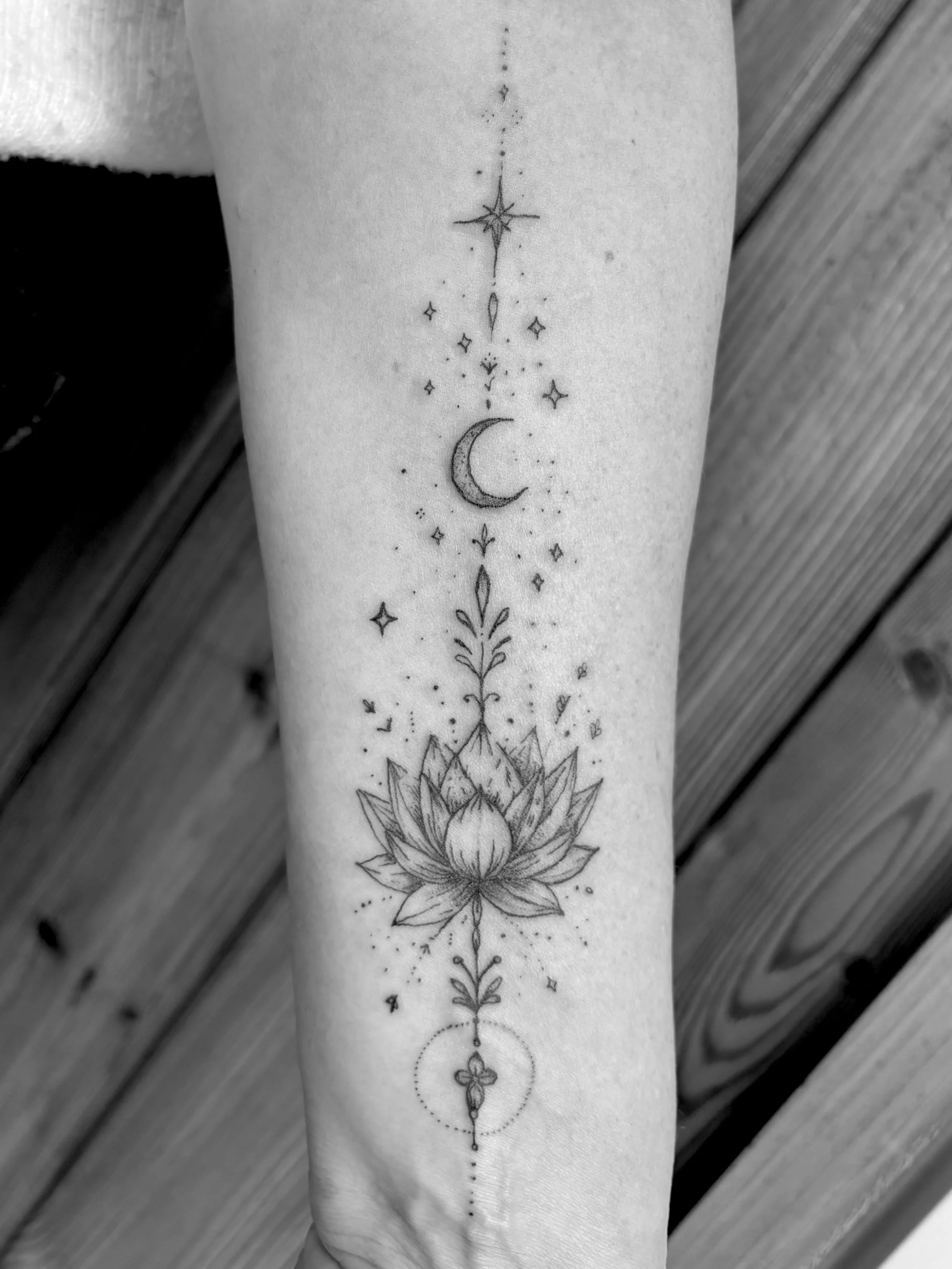 fineline wrist lotus tattoo