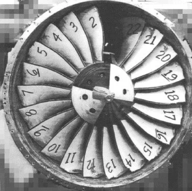 A black and white photograph of a fan blade showing a blade off test.