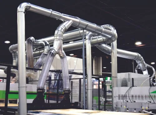 Industrial pipes and ducts in a factory setting