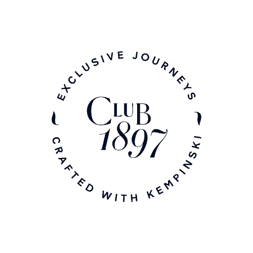 The Club Tour logo with circular layout, featuring text around the perimeter and center on a dark background. Private travel club offering curated journeys, member-only experiences, and VIP perks