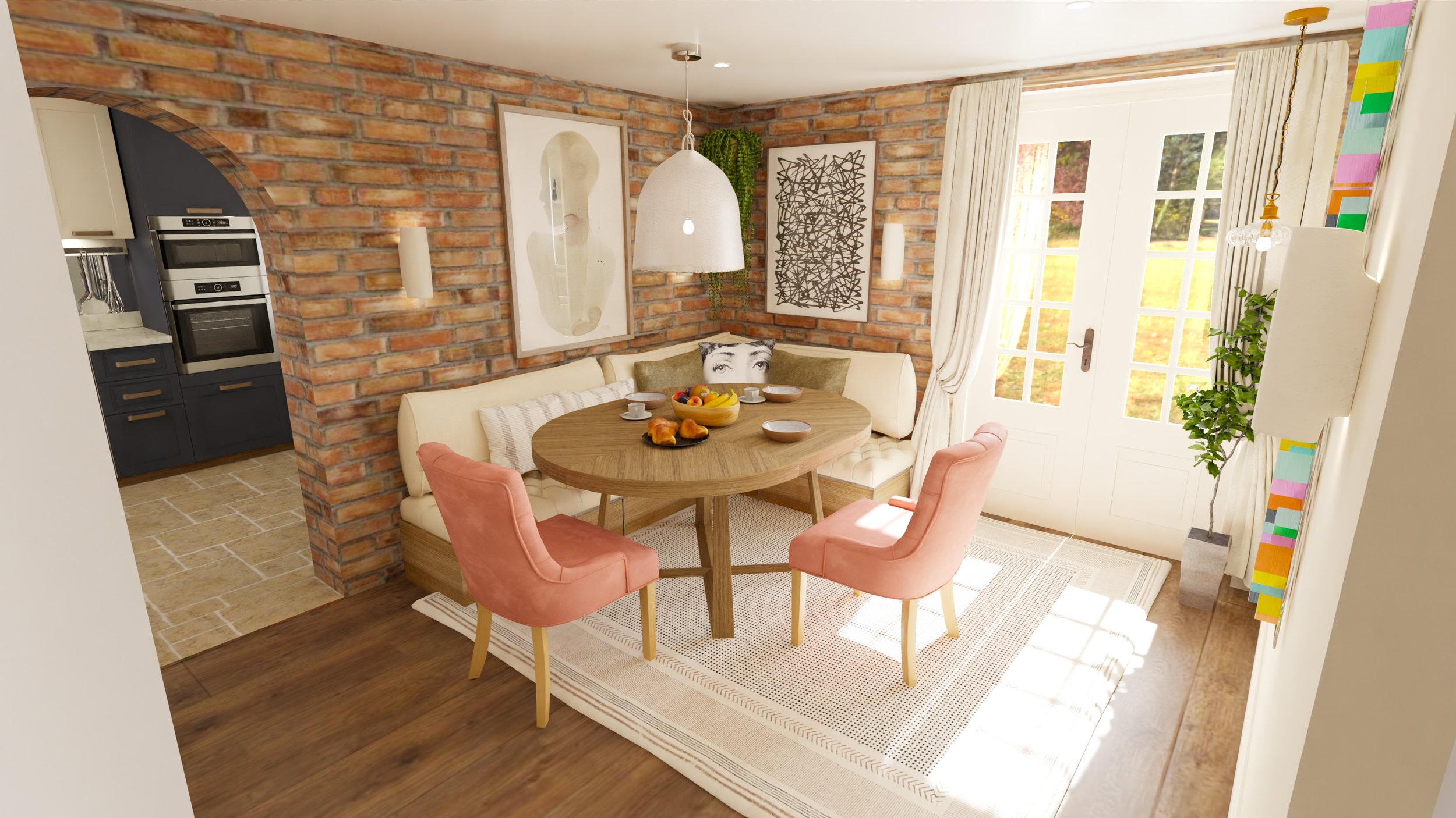 Bright dining area with brick wall, corner banquette with throw pillows, and pink upholstered chairs around a round wooden table set with breakfast items, in front of large glass doors with white curtains, next to a potted plant and colorful artwork.