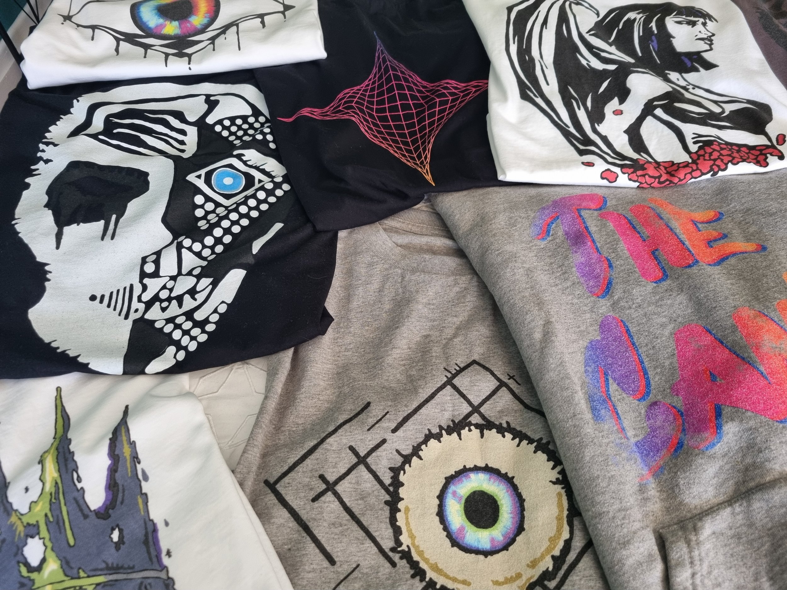 Collection of Mongrel Logic sustainable streetwear featuring original artwork from The Canis.