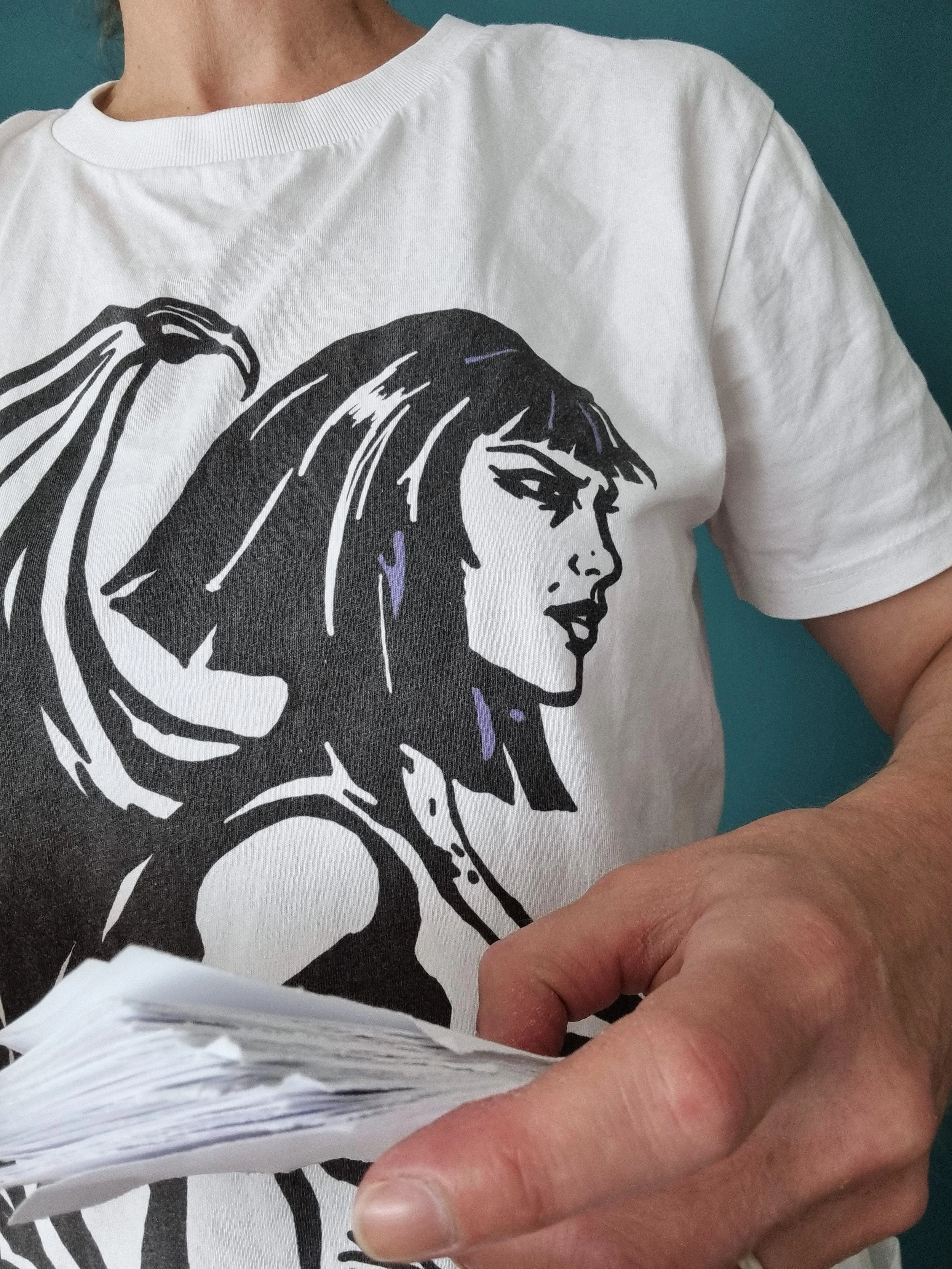 Mongrel Logic organic cotton T-shirt featuring the illustrated character Logic, shown being worn.