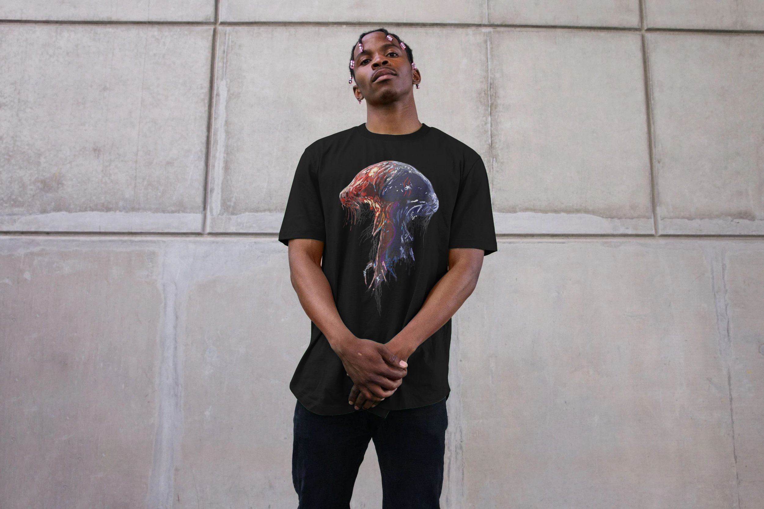 Model wearing Spineless design by Mongrel Logic, featuring a condition from The Canis. Red and blue split design on organic cotton, representing systemic pressure and the forces that spread.