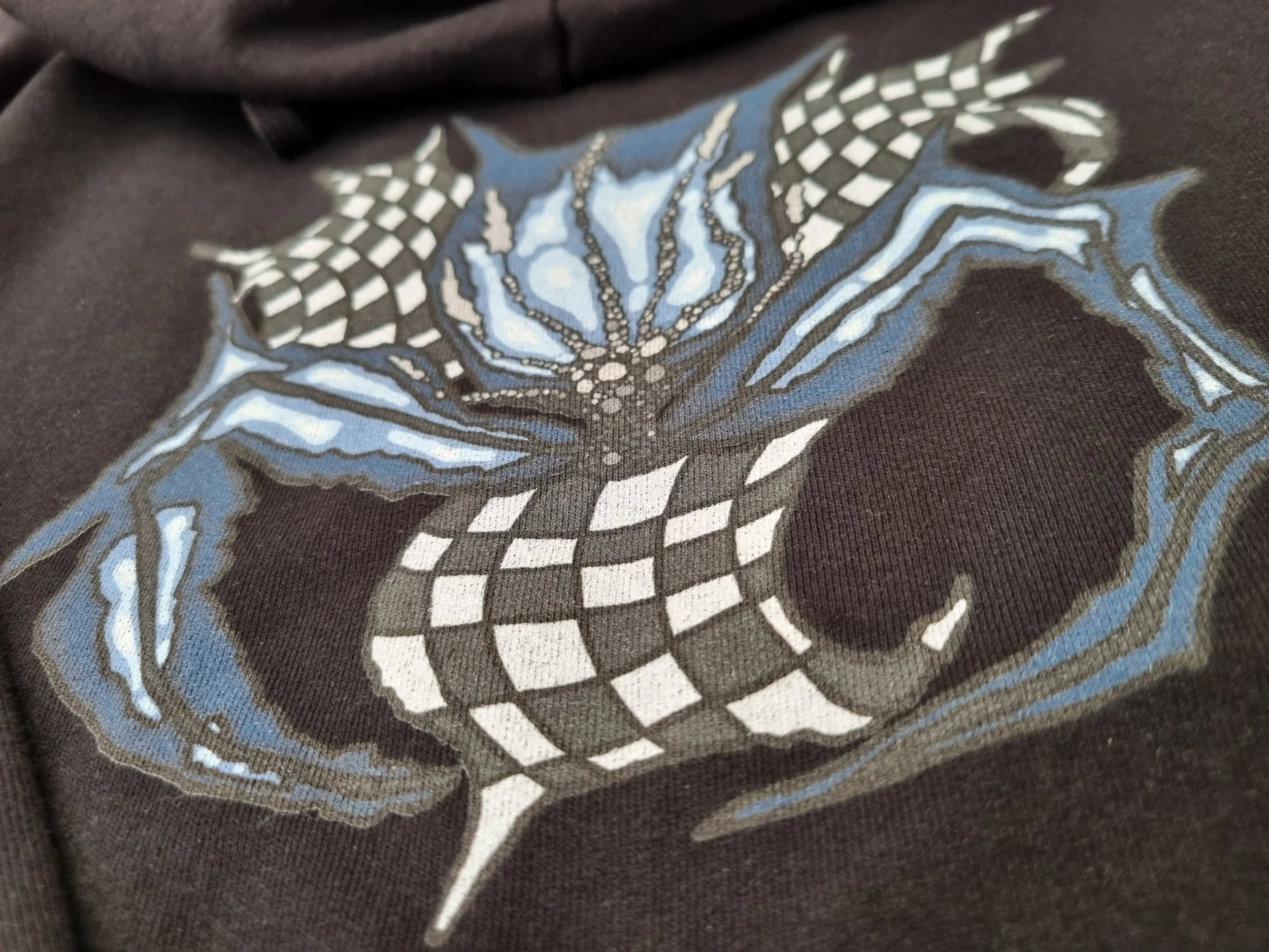 Close-up macro of 340gsm organic cotton hoodie fabric showing dense weave and structure.