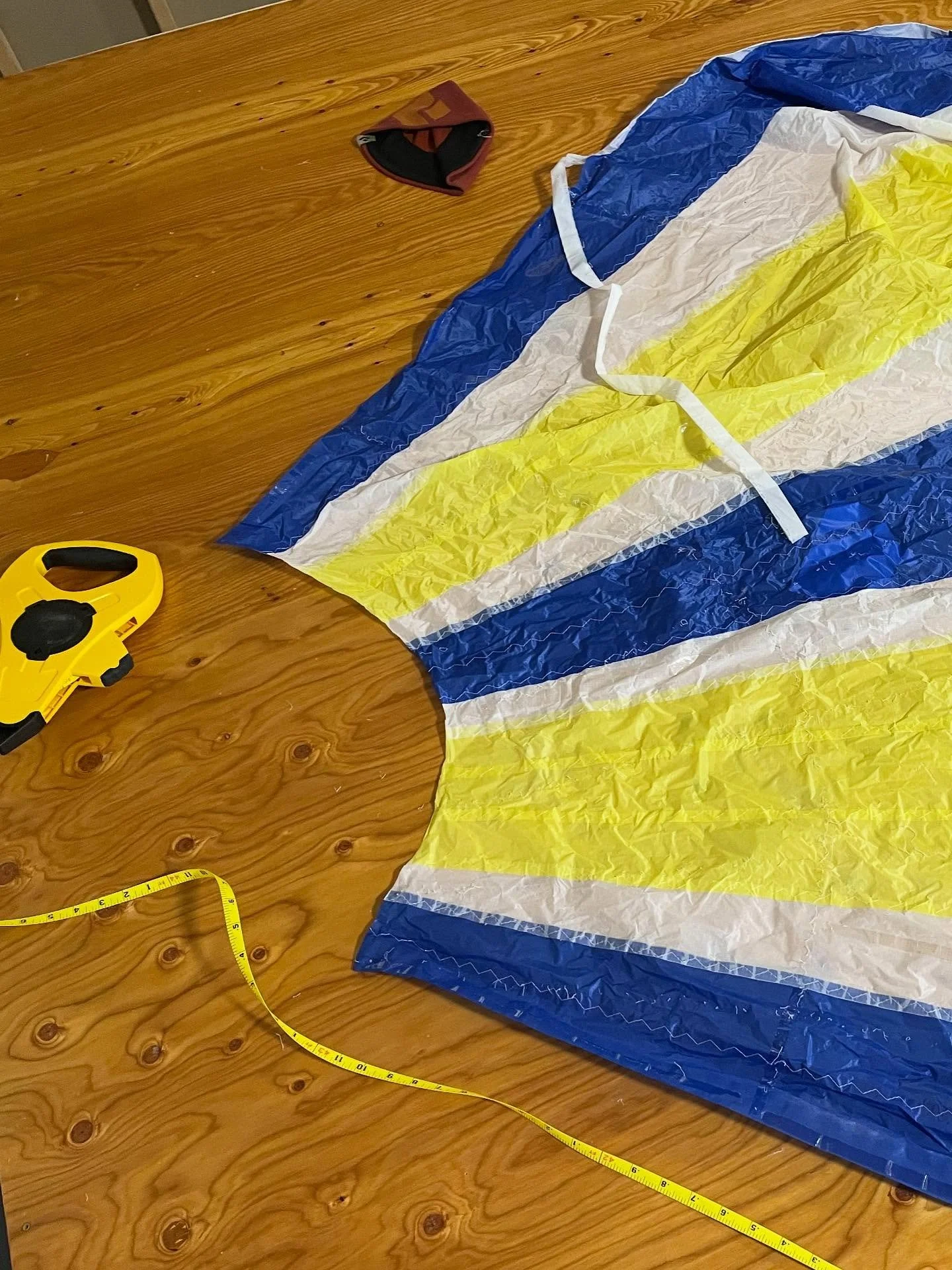 Recutting the foot of an asymmetric spinnaker for a Pearson 365. Pulled out the 3-step machine. Tackless? Tactless?