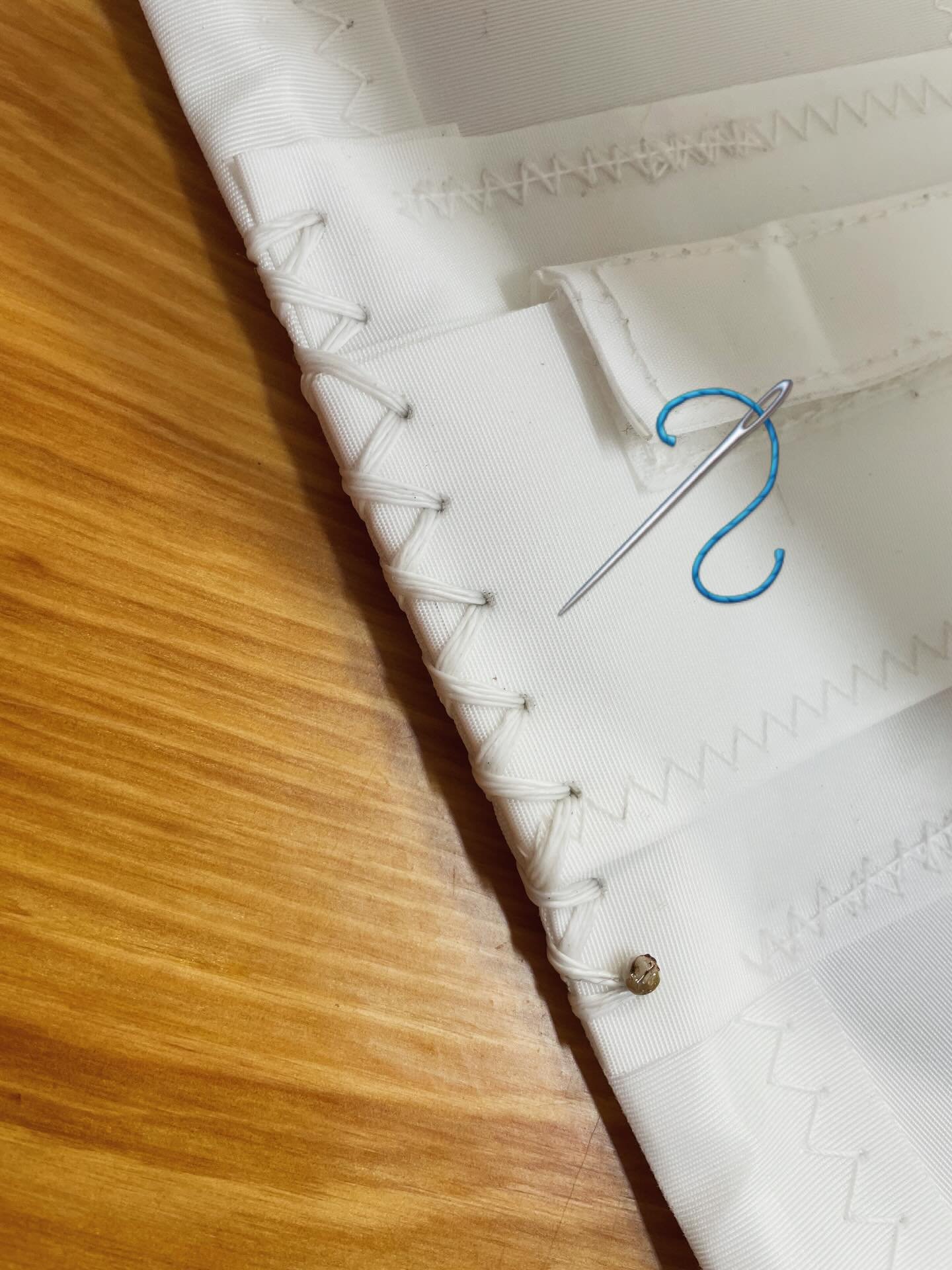Nothing more satisfying than hand stitching a batten pocket end. 

#sailmaking #newsails #madeinmaine