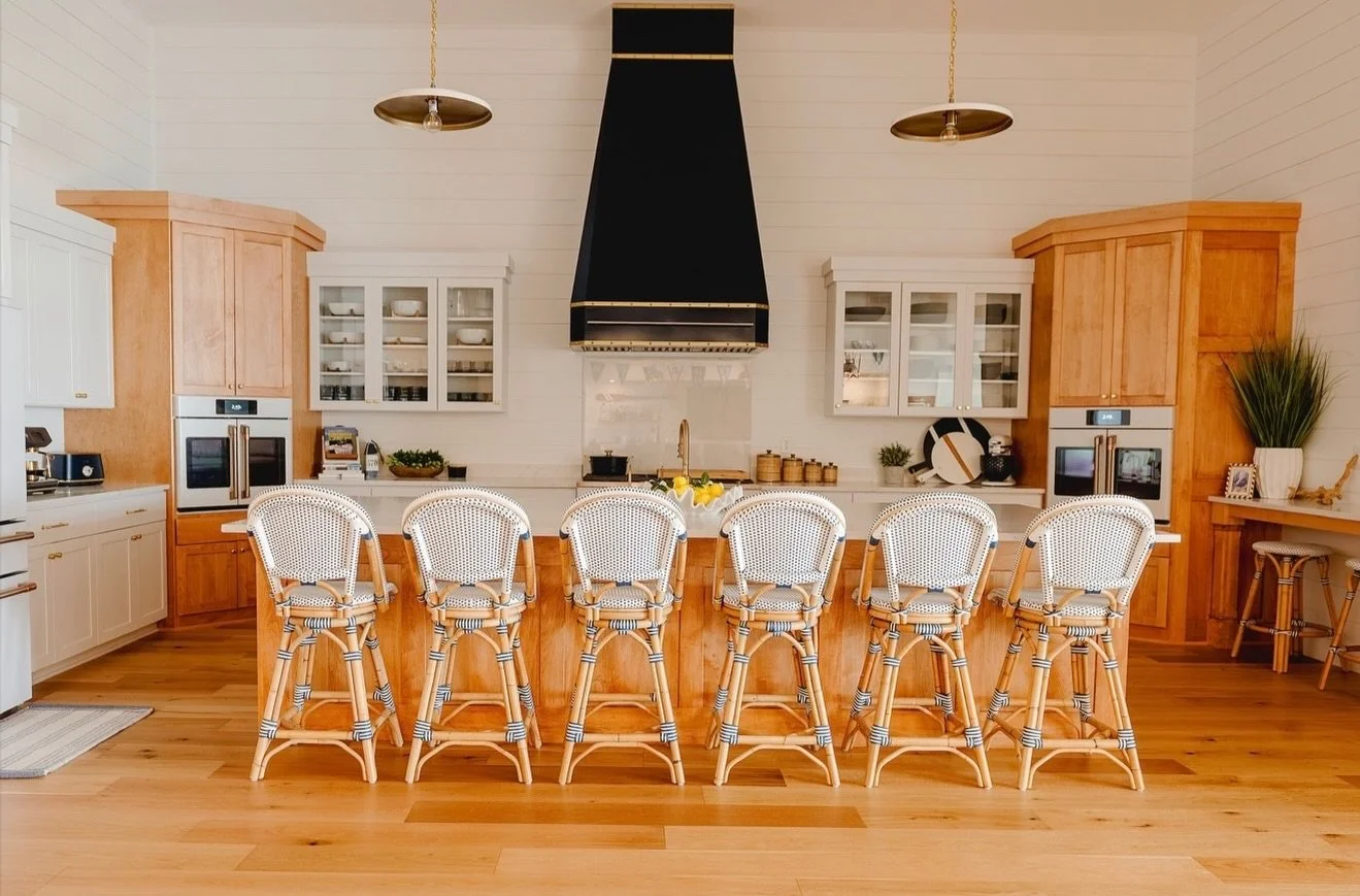 East Coast vibes on Lake Erie! 

Designed to feel timeless, airy, and effortlessly elevated &mdash; this kitchen blends warm white oak cabinetry, woven textures, and a dramatic custom 90&rdquo; hood to create the perfect balance of coastal charm and 