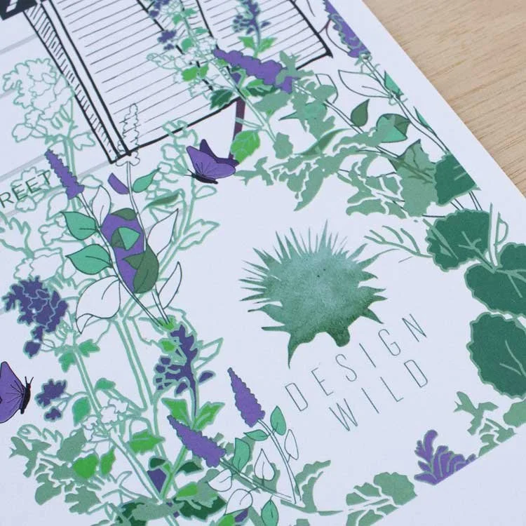 A botanical illustration featuring various green and purple plants, a spiky green cactus in the center with the text "Design Wild" beneath it, and a partially visible grid or plan in the background.