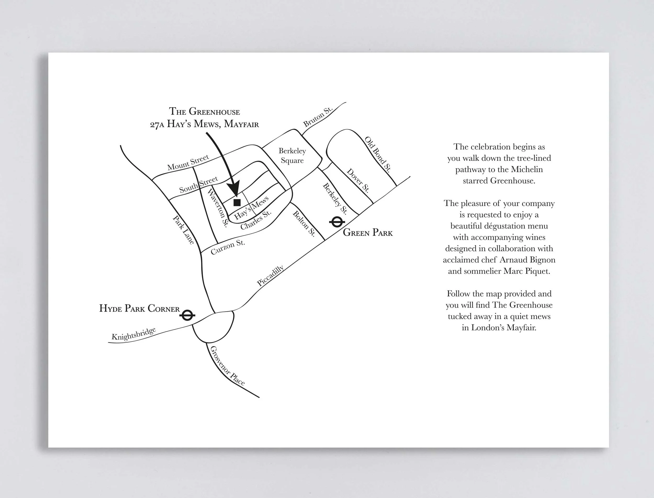 Back of corporate invitation featuring simple and elegant black map detailing location of the event