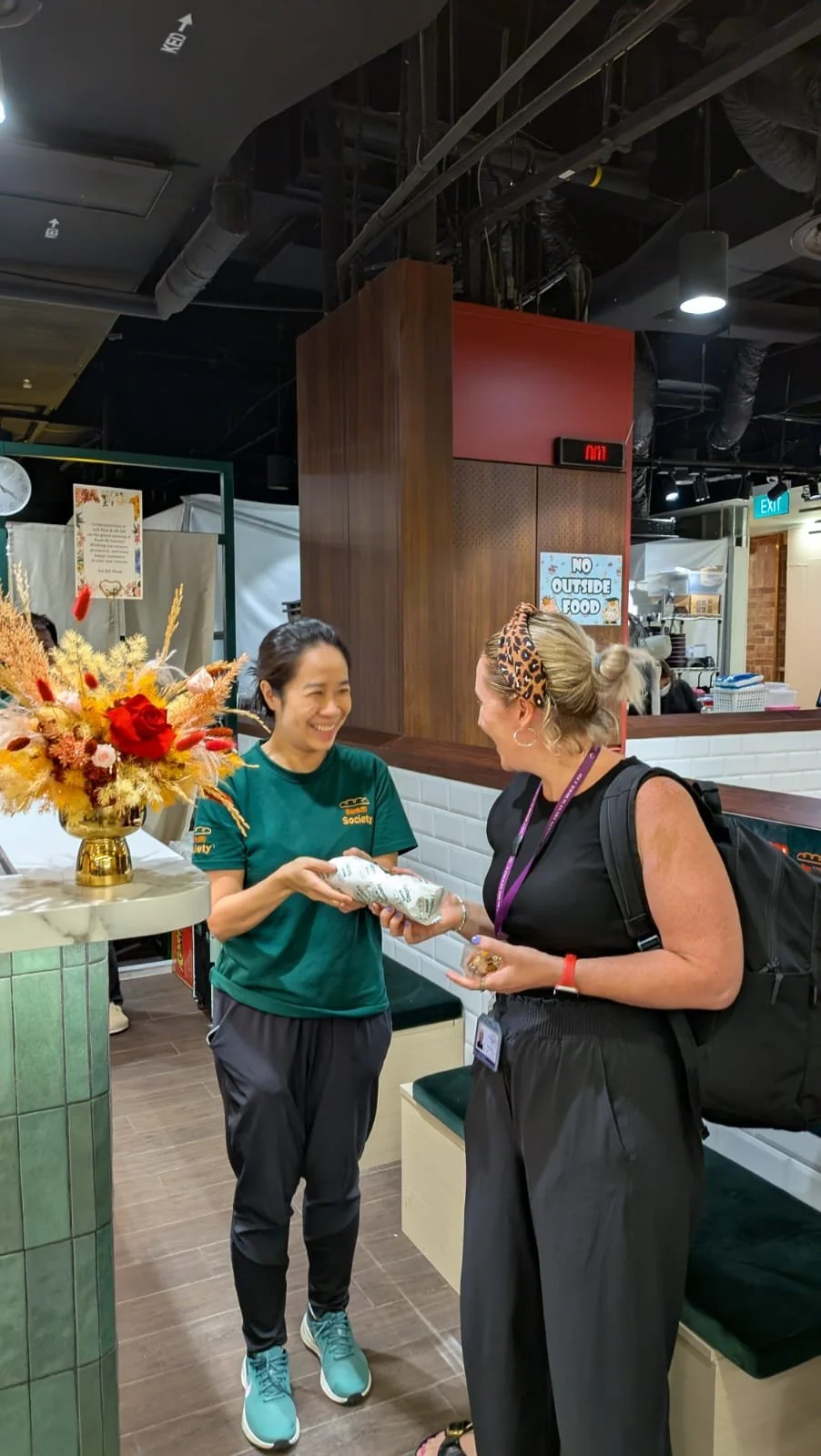 Greeting a special customer whose mother-in-law in Melbourne urged her to visit this newly opened Banh Mi Society