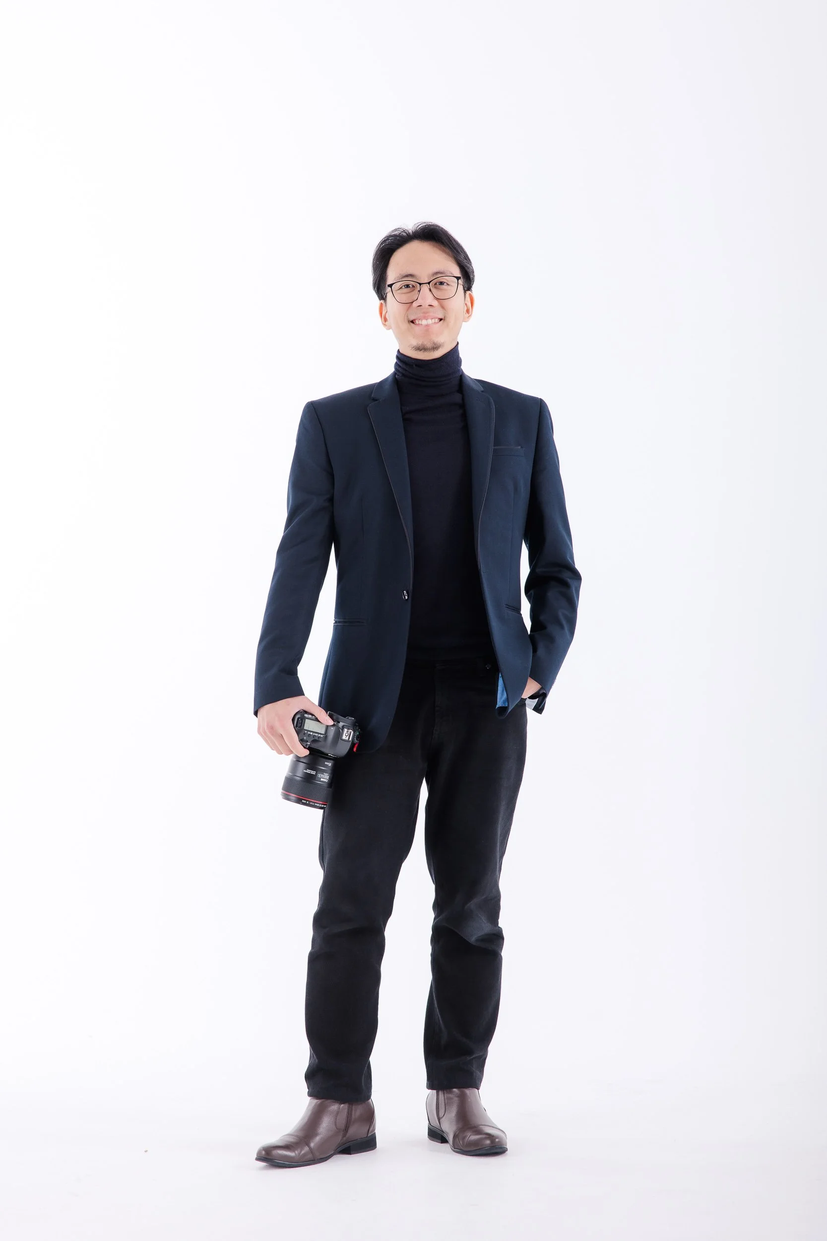 Sherman Tan, Melbourne Lead Wedding Photographer of Sherman Tan Studio, elegant portrait with a clean white background.