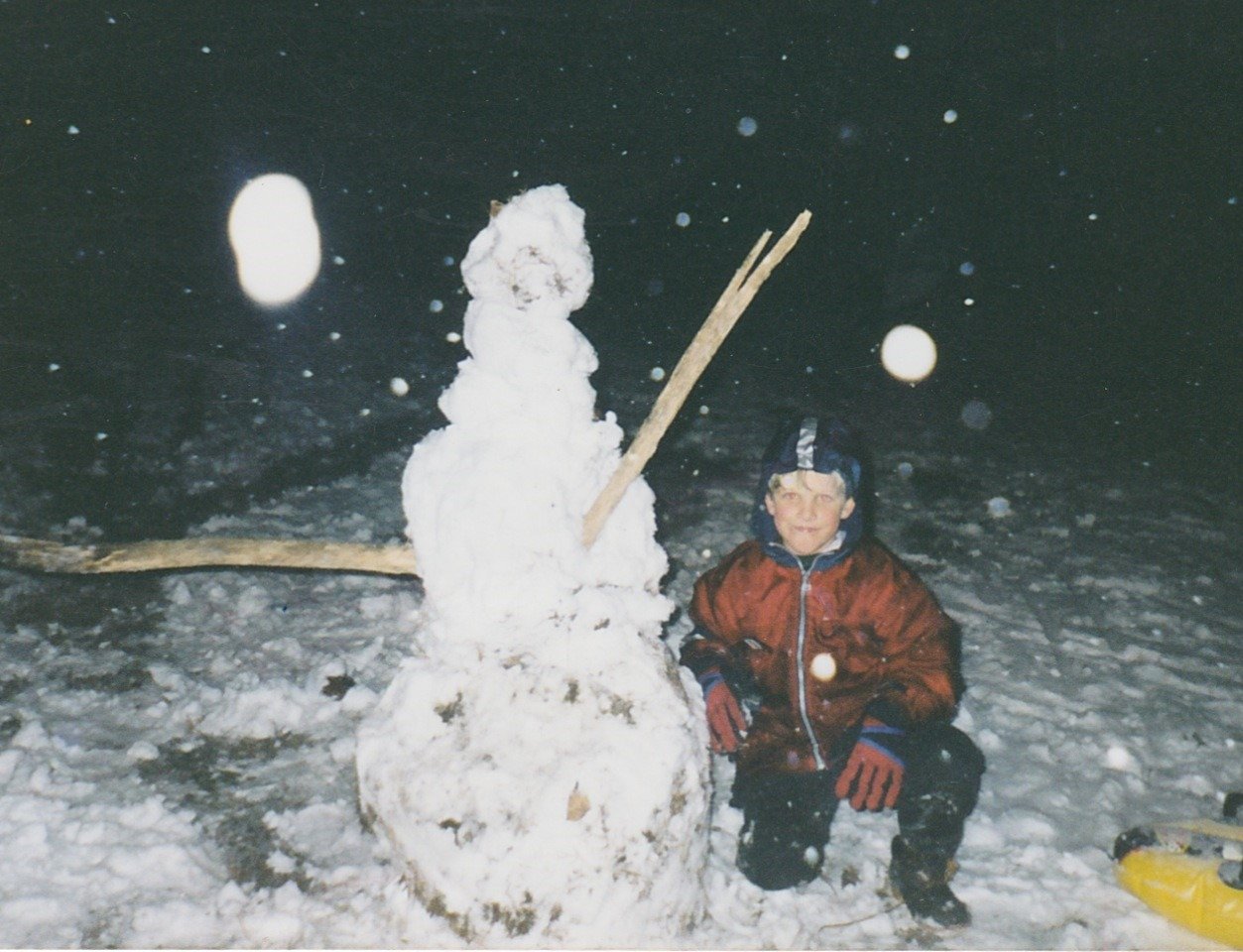Robbie with snowman in Lowell