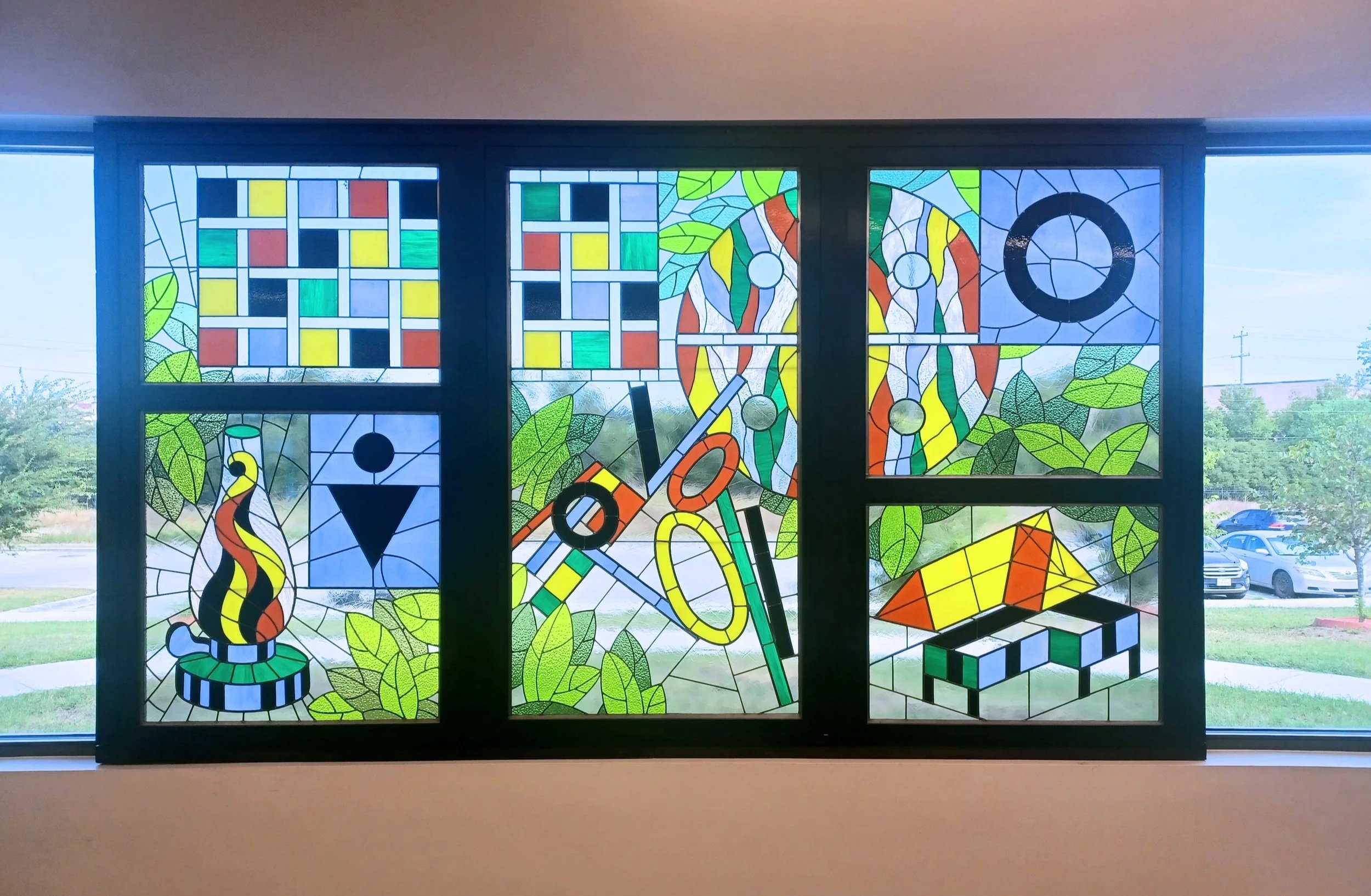 Custom stained glass window by Sondra Kretschmar of Esaltare Arts, installed at the San Marcos Library