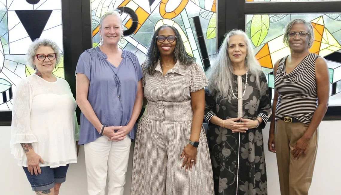Photo of Sondra Kretschmar at the dedication ceremony for public arts commission at San Marcos Public Library. Bill Hutson-inspired stained glass panels Commissioned by San Marcos Arts Commission