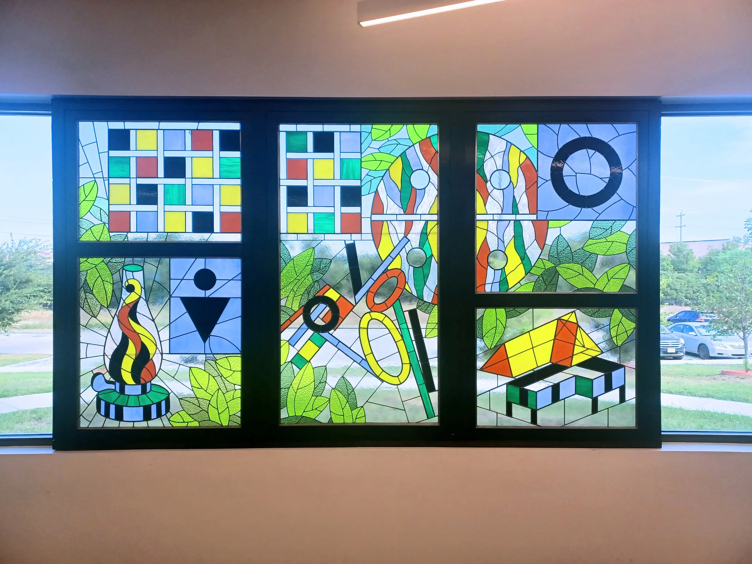 Custom stained glass panels installed at commercial institution San Marcos Public Library