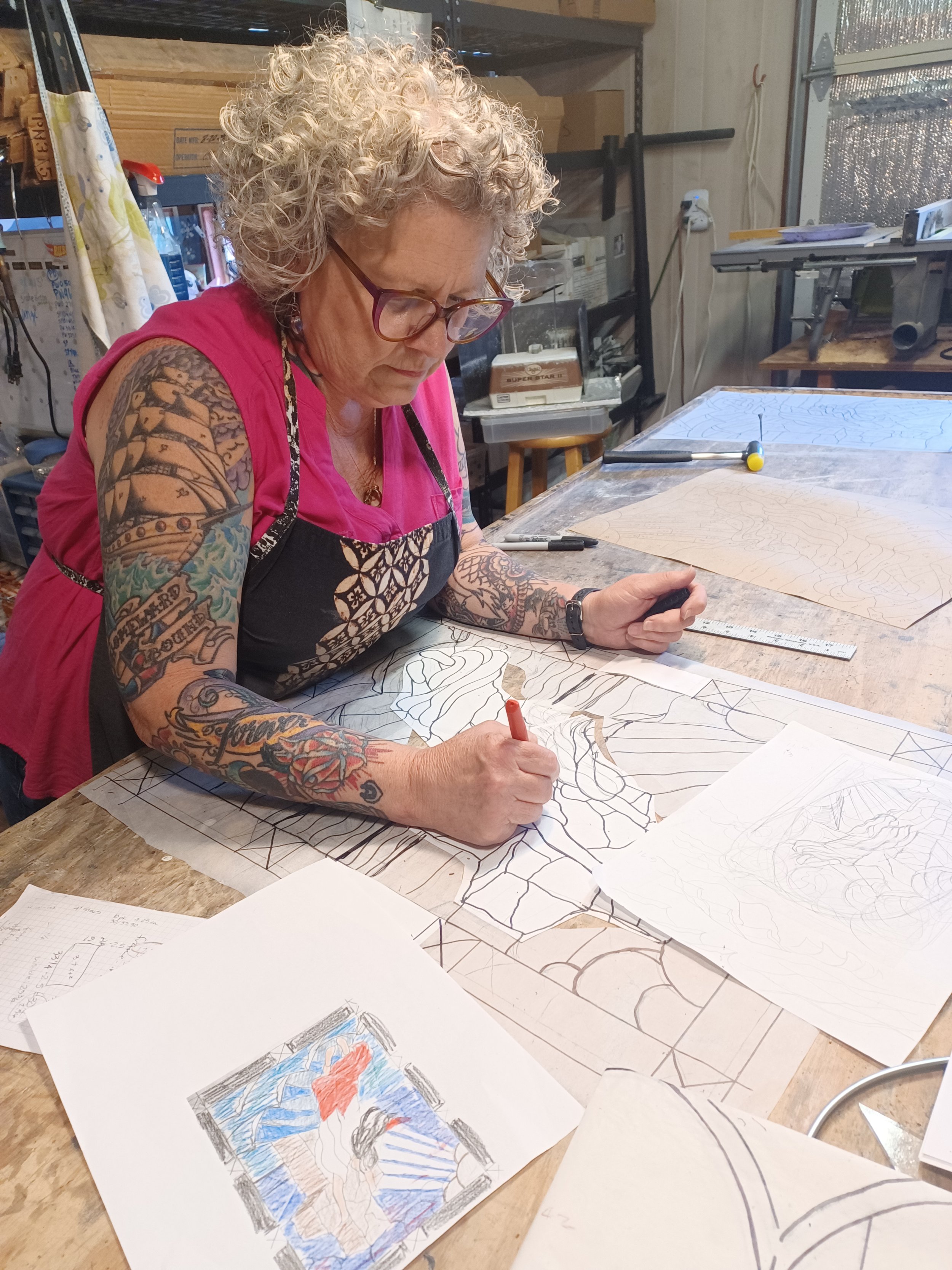 Sondra Kretschmar of Esaltare Arts, designing custom stained glass panel