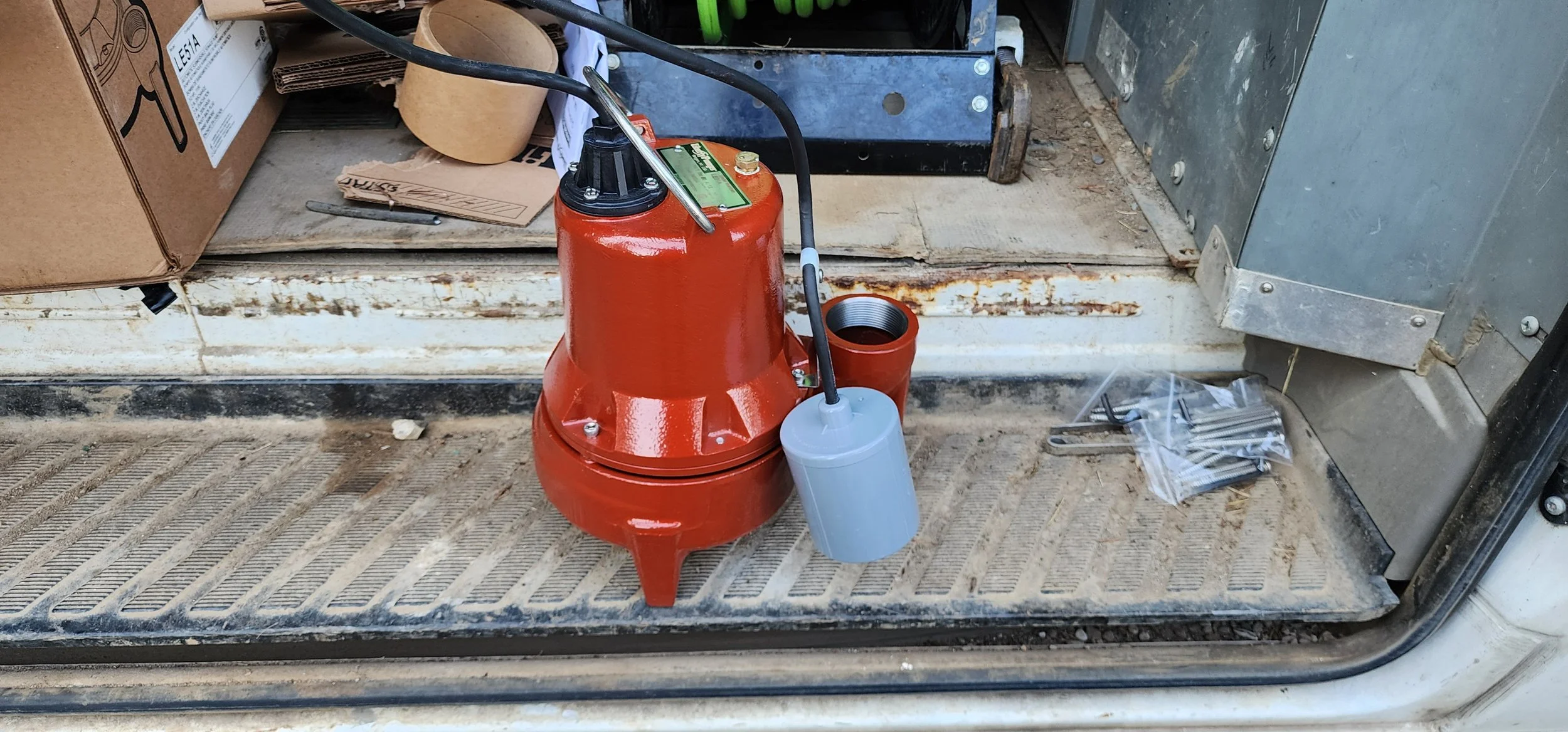 Here is a photo of a Solids Handeling Pump with float switch attached to it.  This pump is often miscalled a Grinder Pump.  This pump is not.  It can handle human waste and light toilet paper only.  These are often found in basements or crawlspaces.