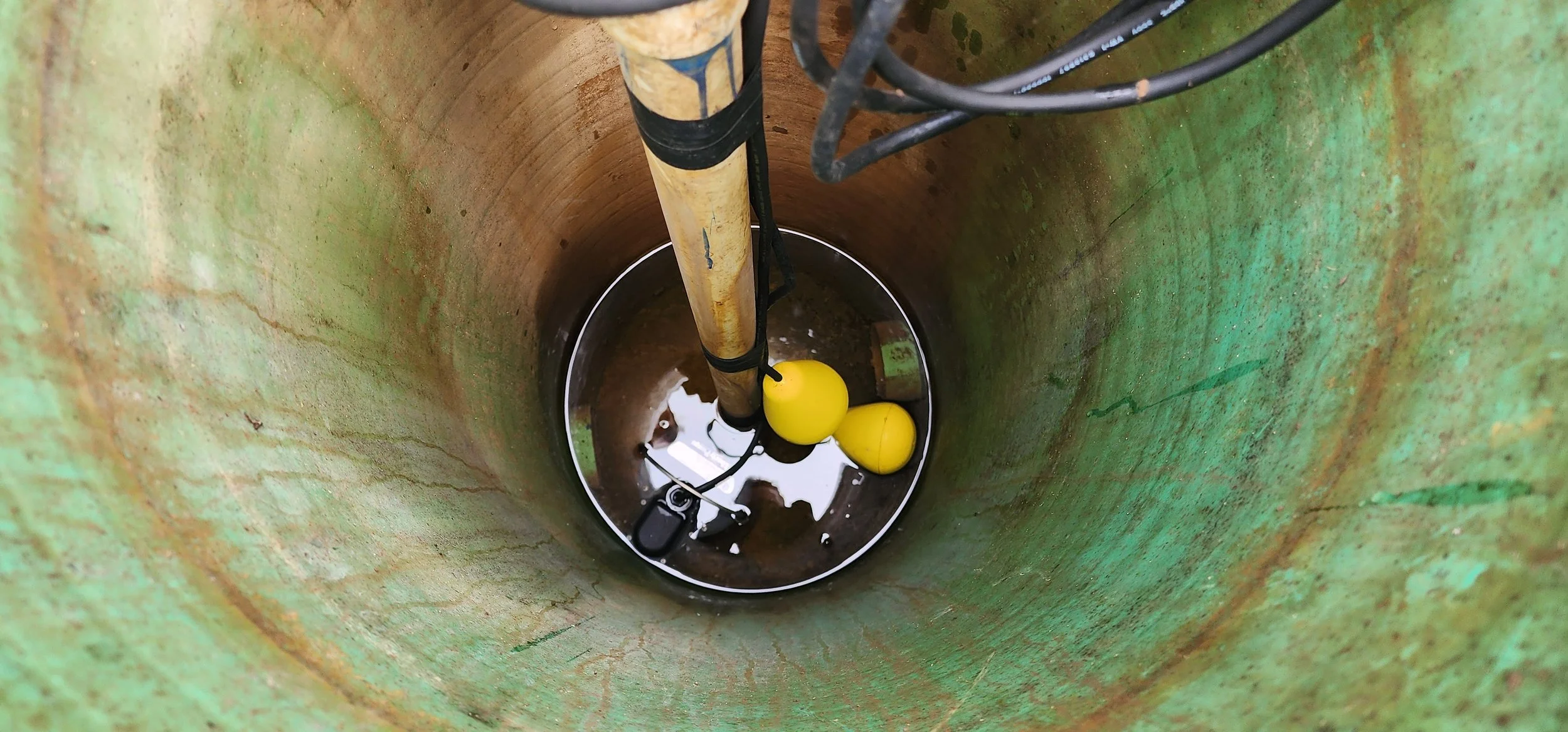 In this effluent pump for a client's sand filter, you can see that the float switches are clean an able to swing without catching on sidewall of tank or cords.  Cords are secure as to not interfere with the floats.