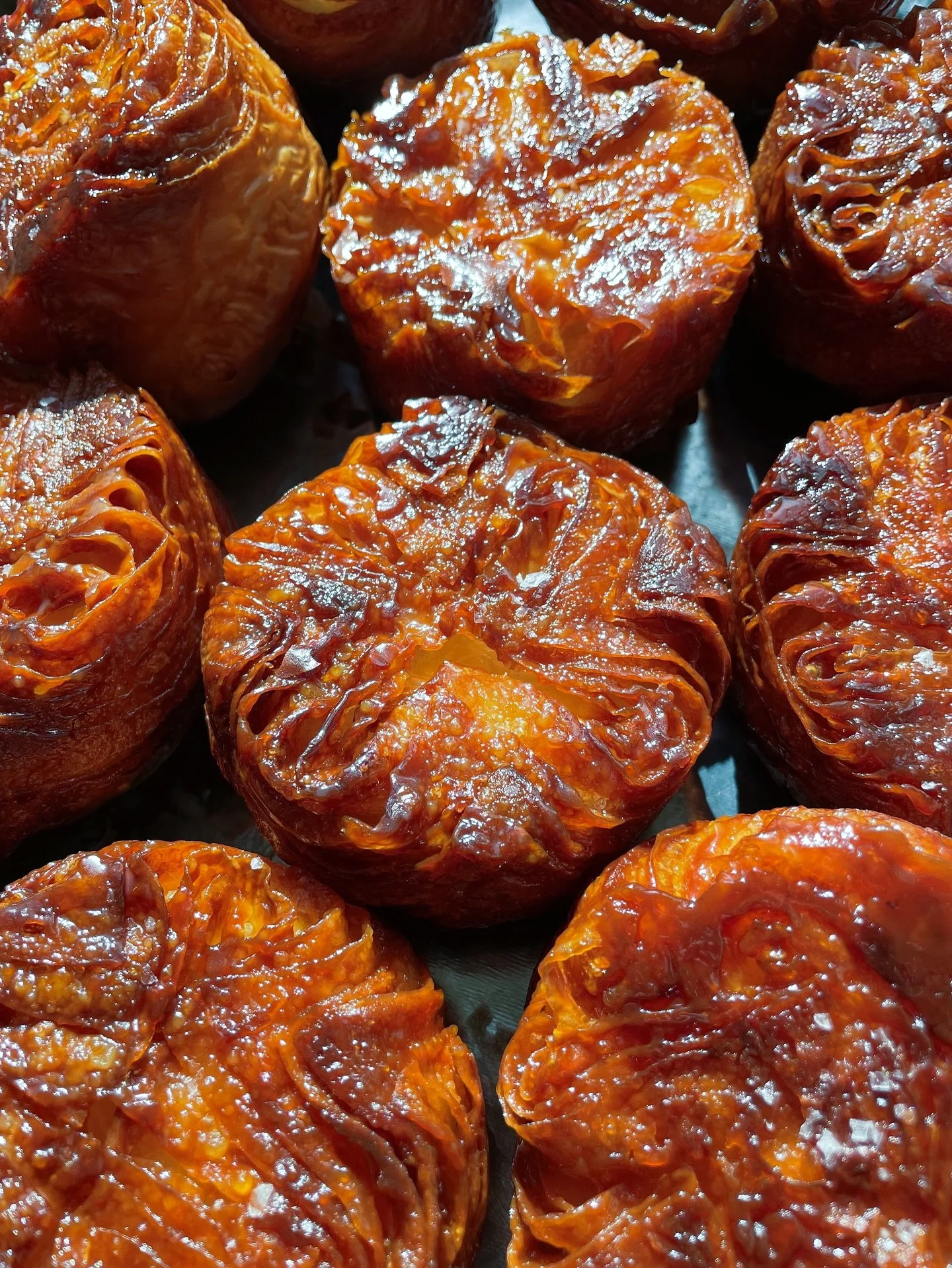 Kouign amann is a Breton pastry that&rsquo;s basically a croissant that decided to roll around in caramelized sugar. Butter, layers, and a crispy-sweet exterior that shatters when you bite in.