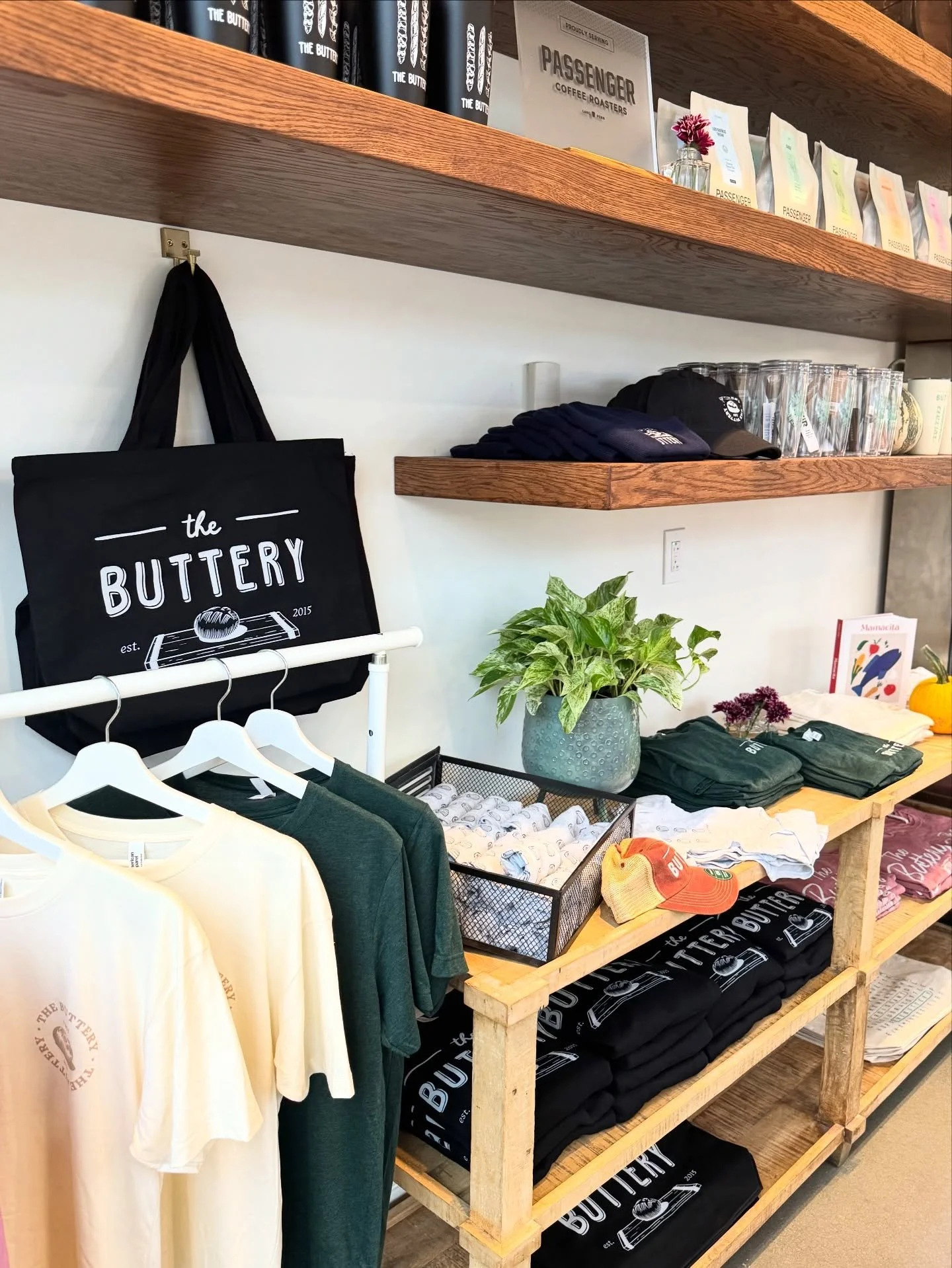 Take a little piece of The Buttery home with you. Hats, tees, cookbooks, and more in our merch corner.