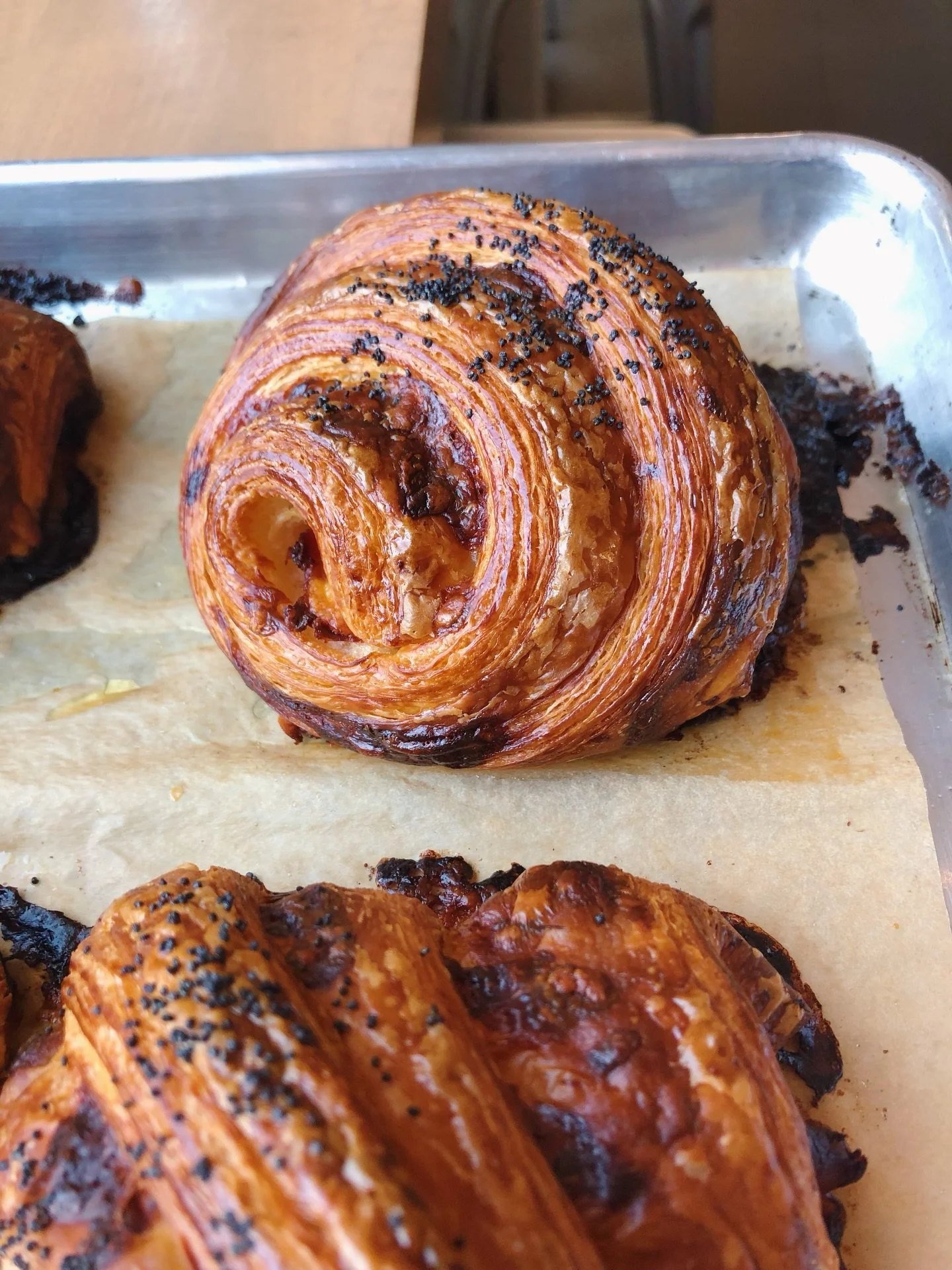 The ham and cheese croissant, done the way it deserves. Prosciutto cotto, aged cheddar and gruy&egrave;re all folded into our laminated dough and topped with poppy seeds.