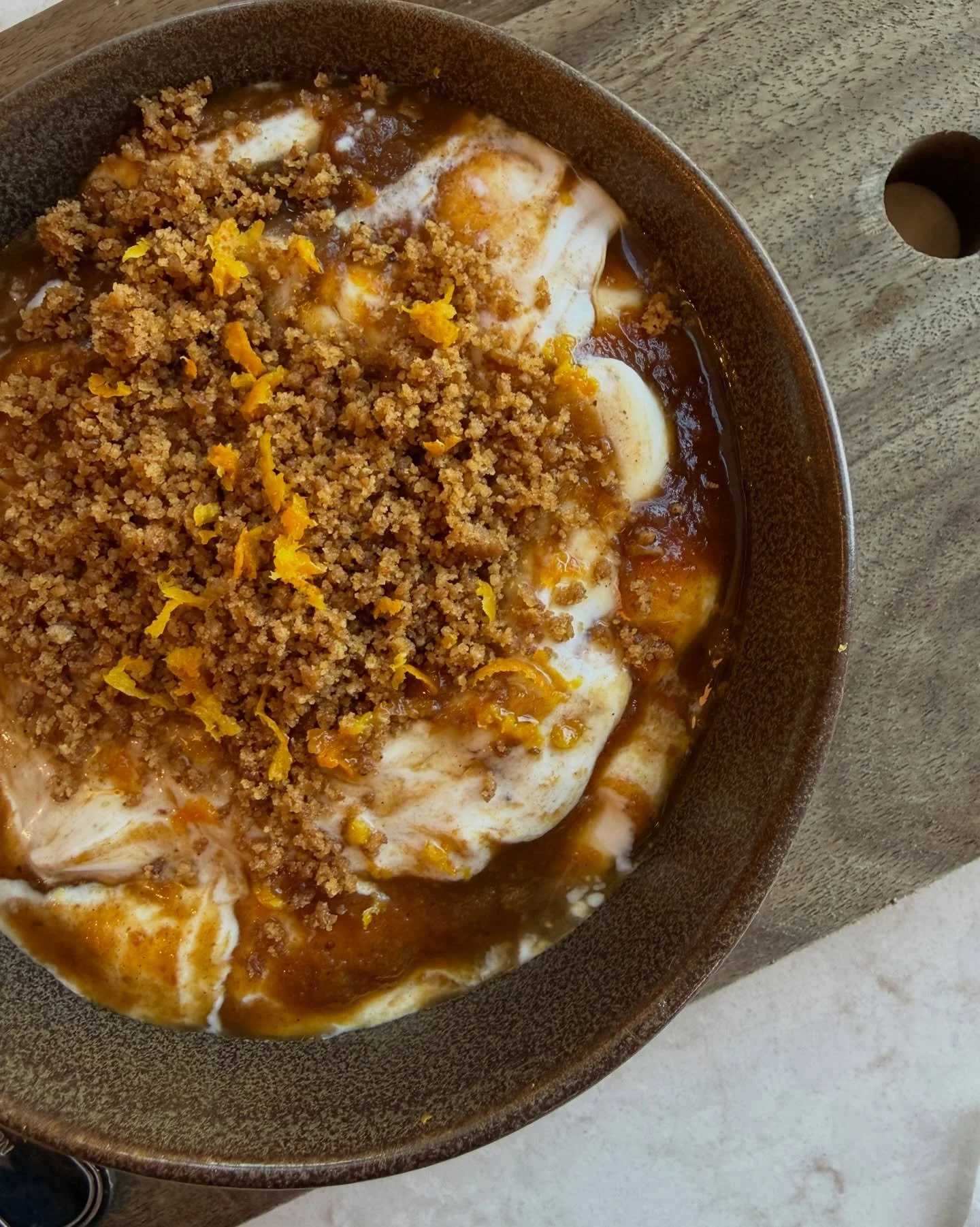 We took apart a pumpkin pie and rebuilt it for breakfast.

The filling becomes spiced pumpkin butter, swirled through thick greek yogurt. The crust becomes a graham cracker crumble. Maple brings the sweetness, and fresh orange keeps every bite bright